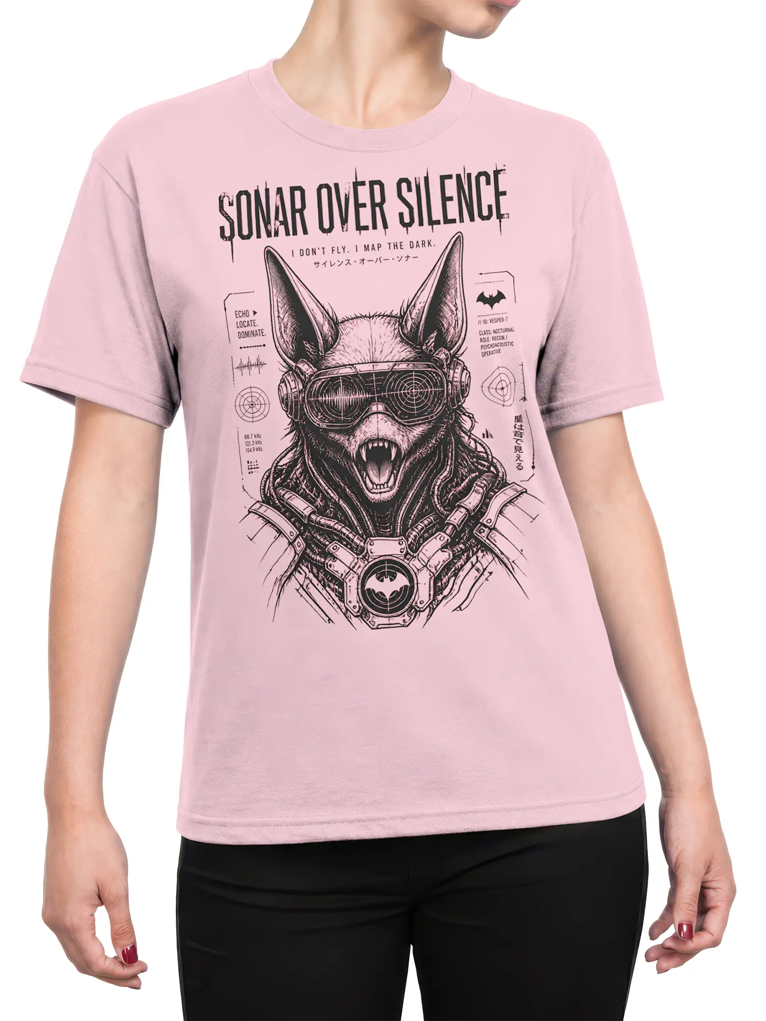 Female torso wearing a pink bat graphic tee with goggles, fangs, sonar details, and dark technical lettering