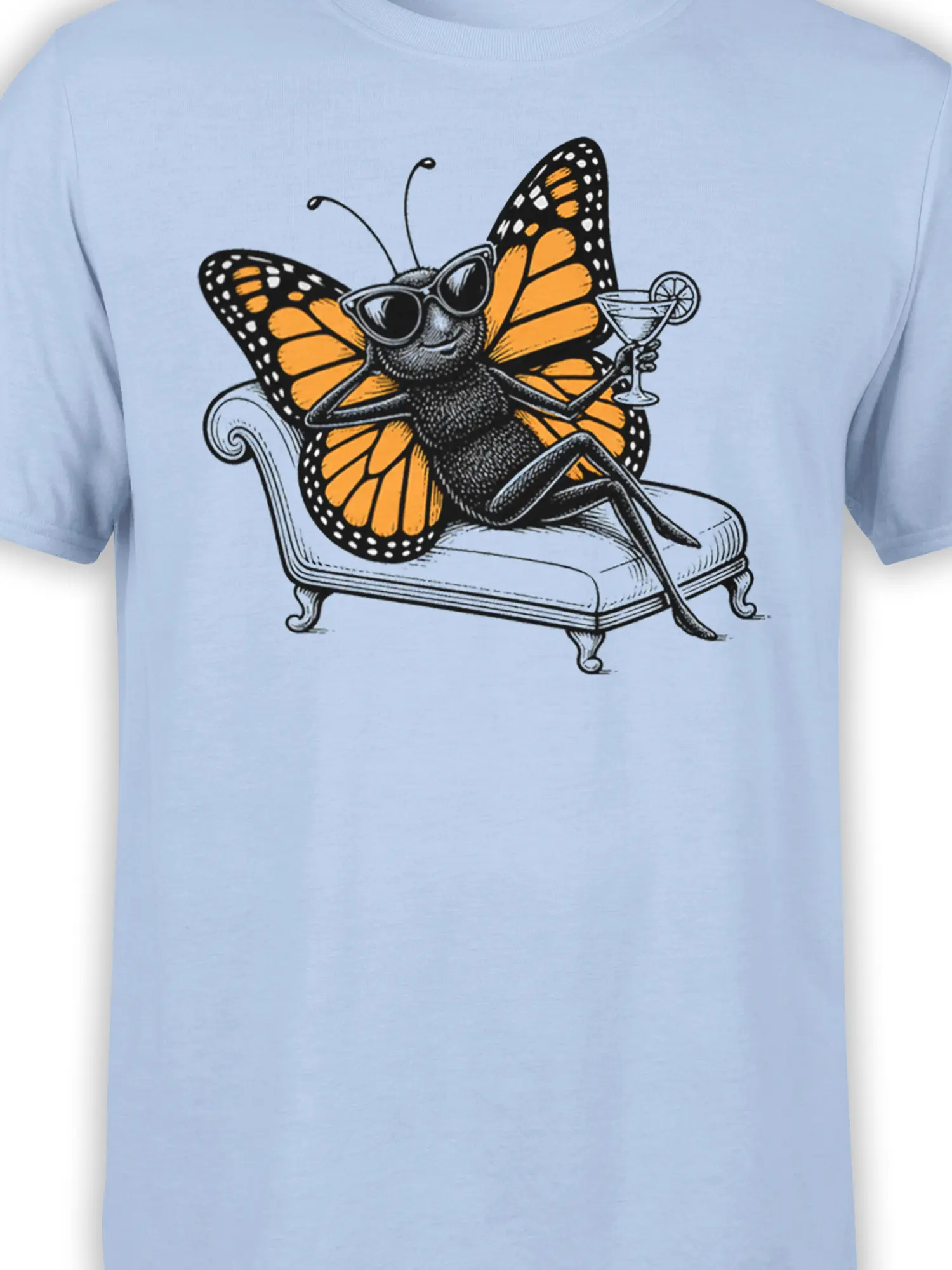 Close-up of black-and-orange butterfly artwork in sunglasses on a light blue T-shirt