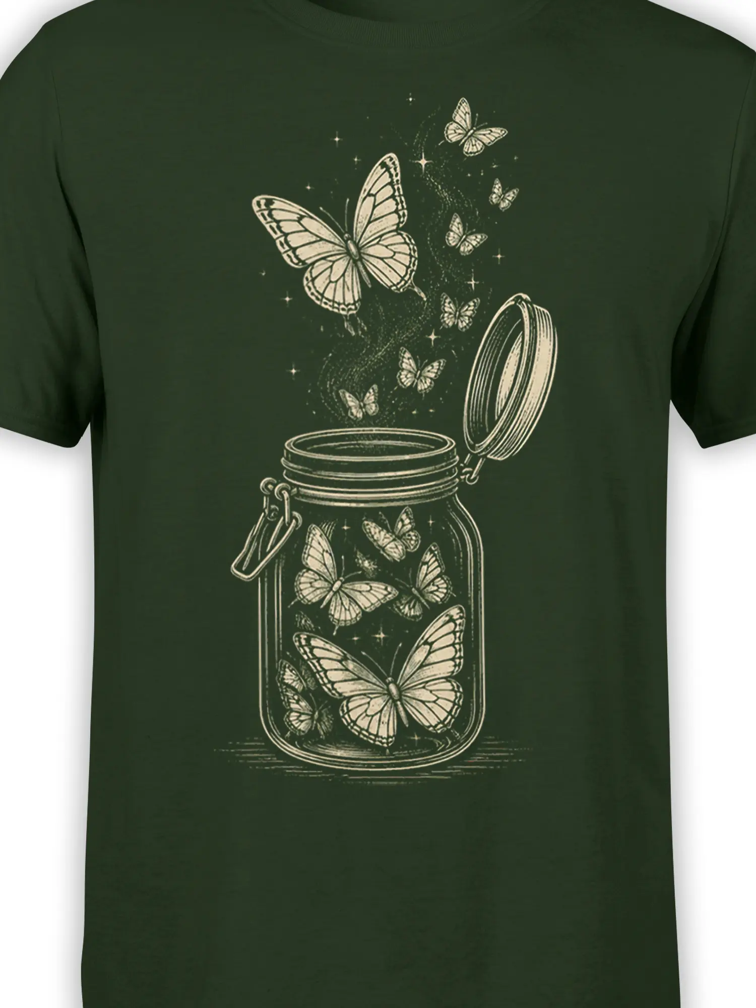 Close-up of cream butterfly jar artwork with detailed wings, stars, and an open lid on a green shirt