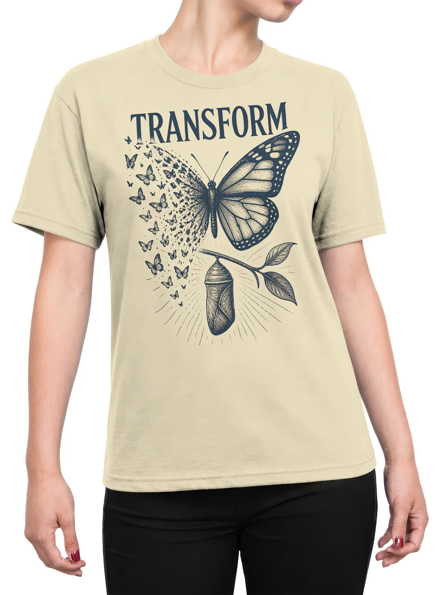 Female torso wearing a beige butterfly transformation T-shirt with deep blue vintage artwork and TRANSFORM lettering