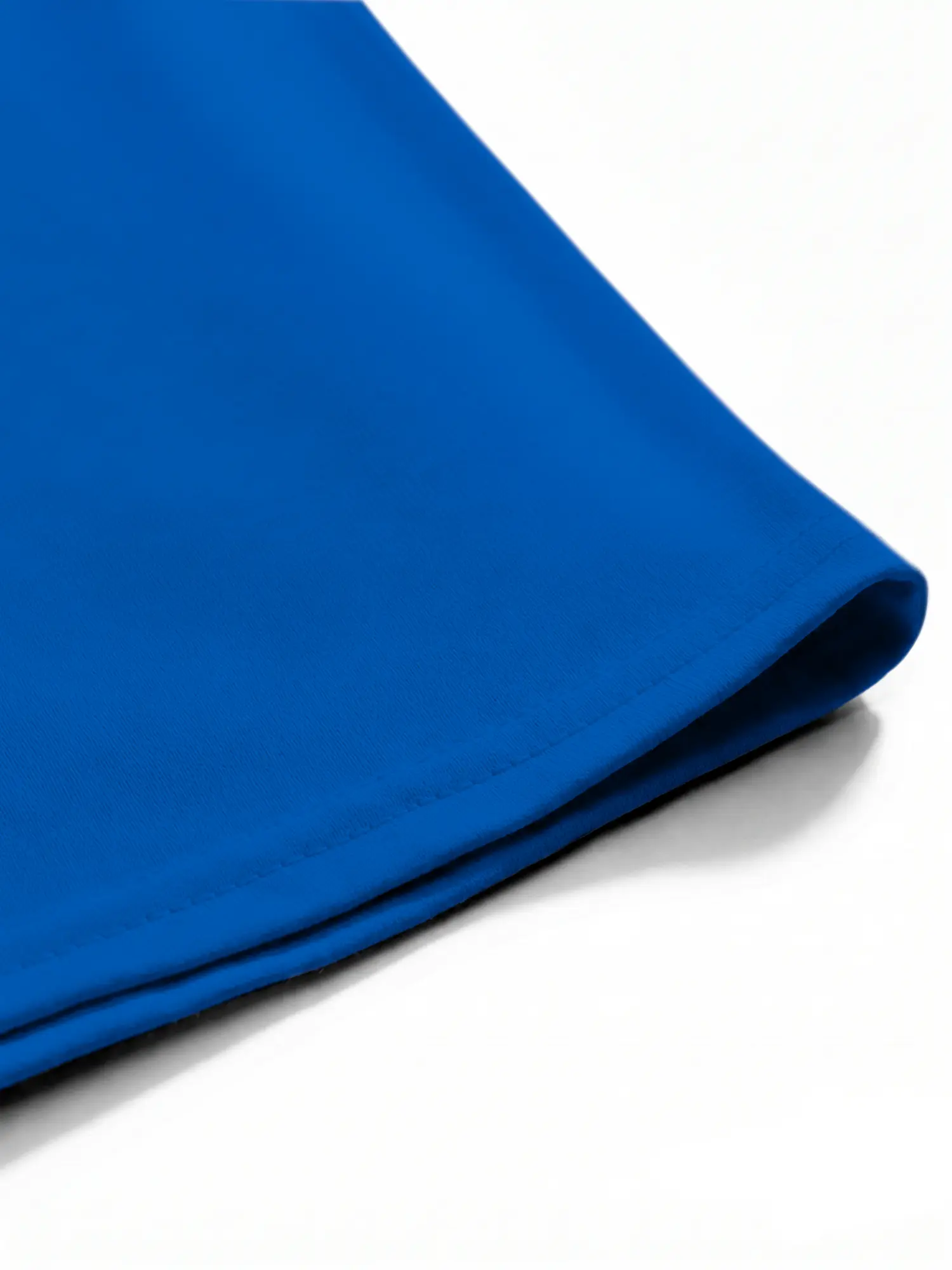 Royal blue T-shirt hem and stitching detail in close-up
