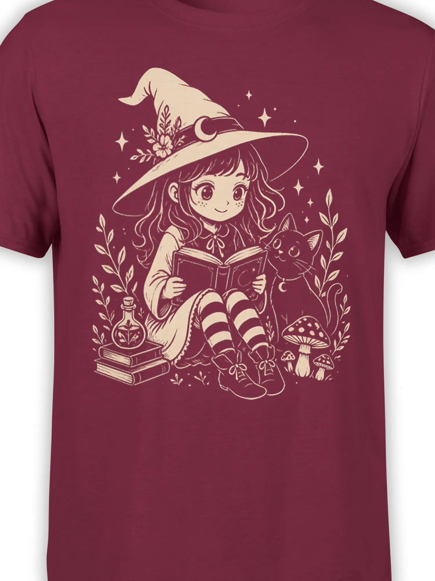 Close-up of a young witch and cat reading beside a spell book on a burgundy fantasy T-shirt