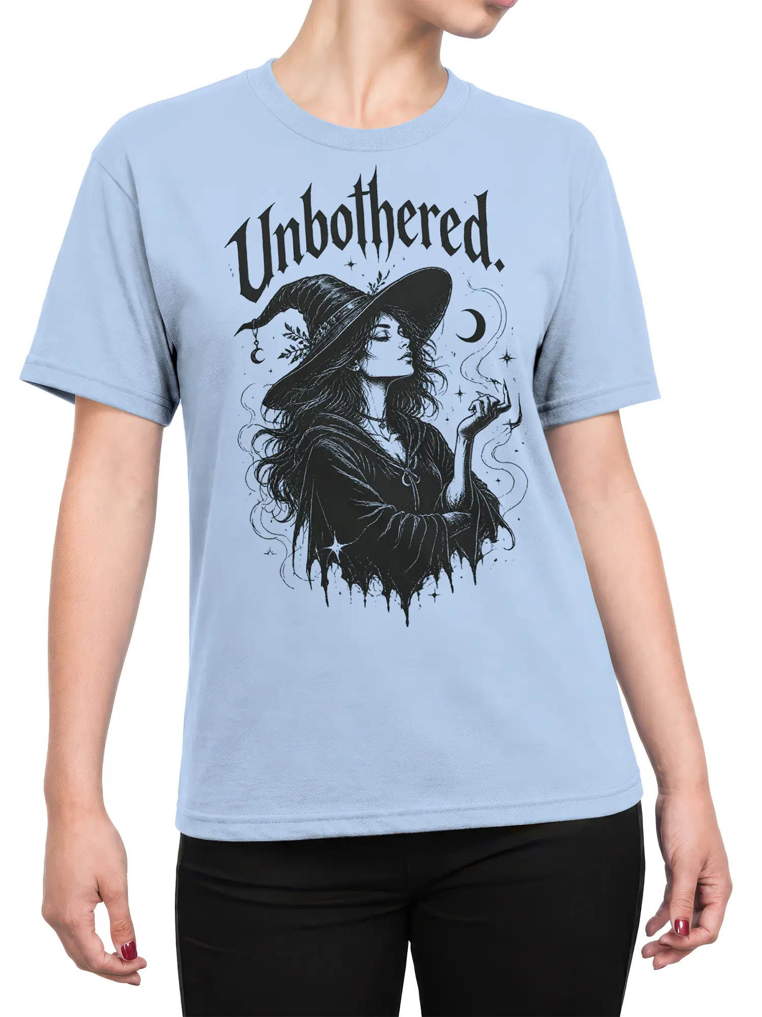 Female torso wearing a light blue witch T-shirt with gothic moon and star artwork