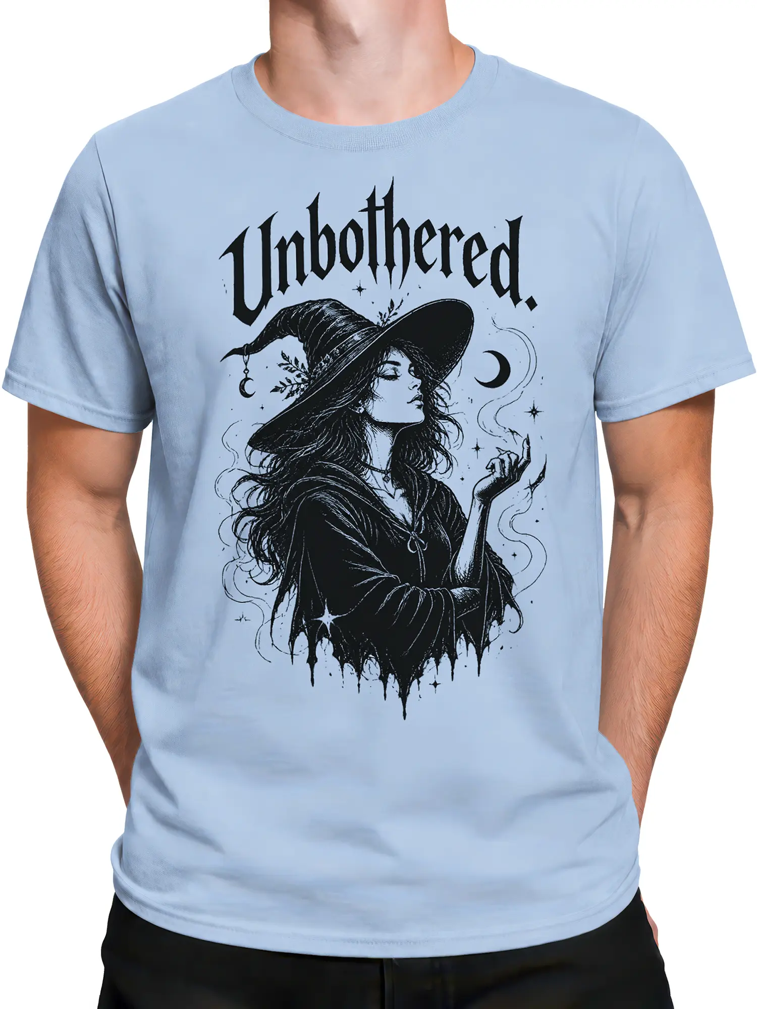 Male torso wearing a light blue T-shirt with unbothered witch and moon artwork