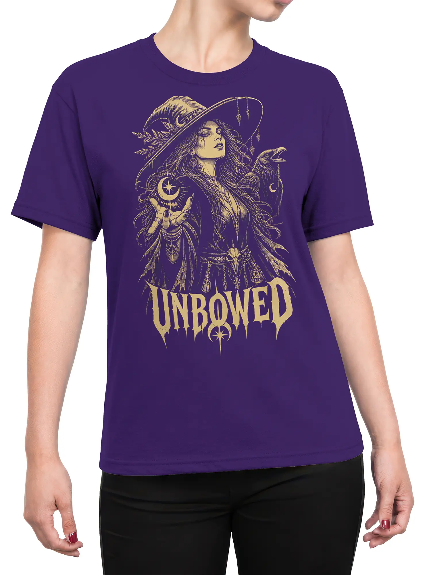 Female torso wearing a purple witch fantasy T-shirt with raven, moon symbols, and UNBOWED graphic