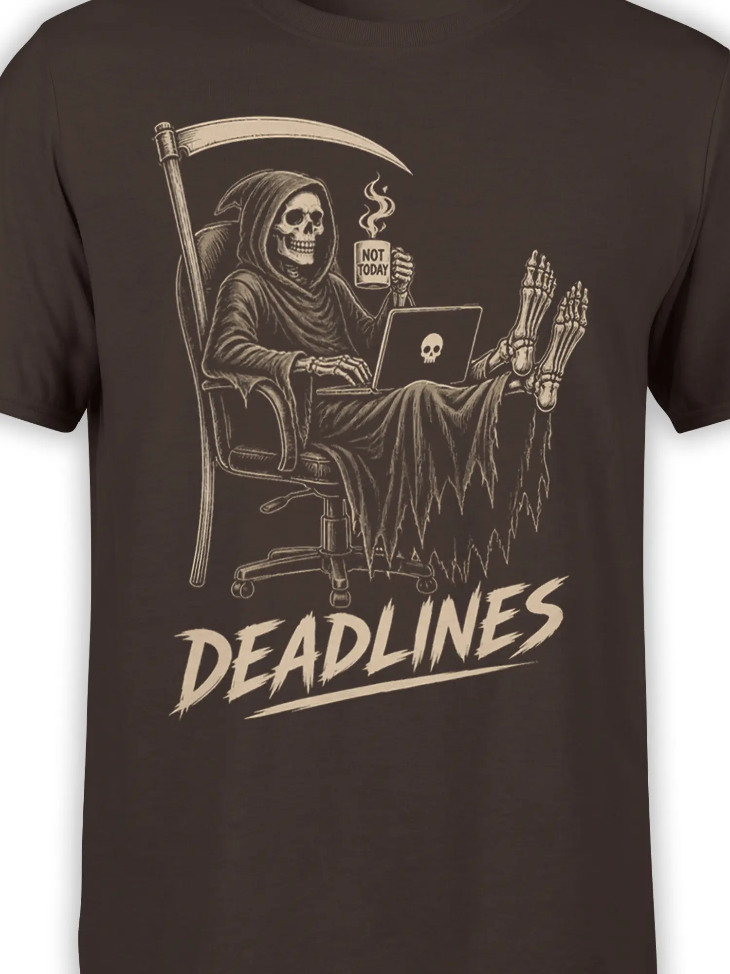 Close-up of grim reaper laptop artwork and “NOT TODAY” mug on a brown graphic T-shirt