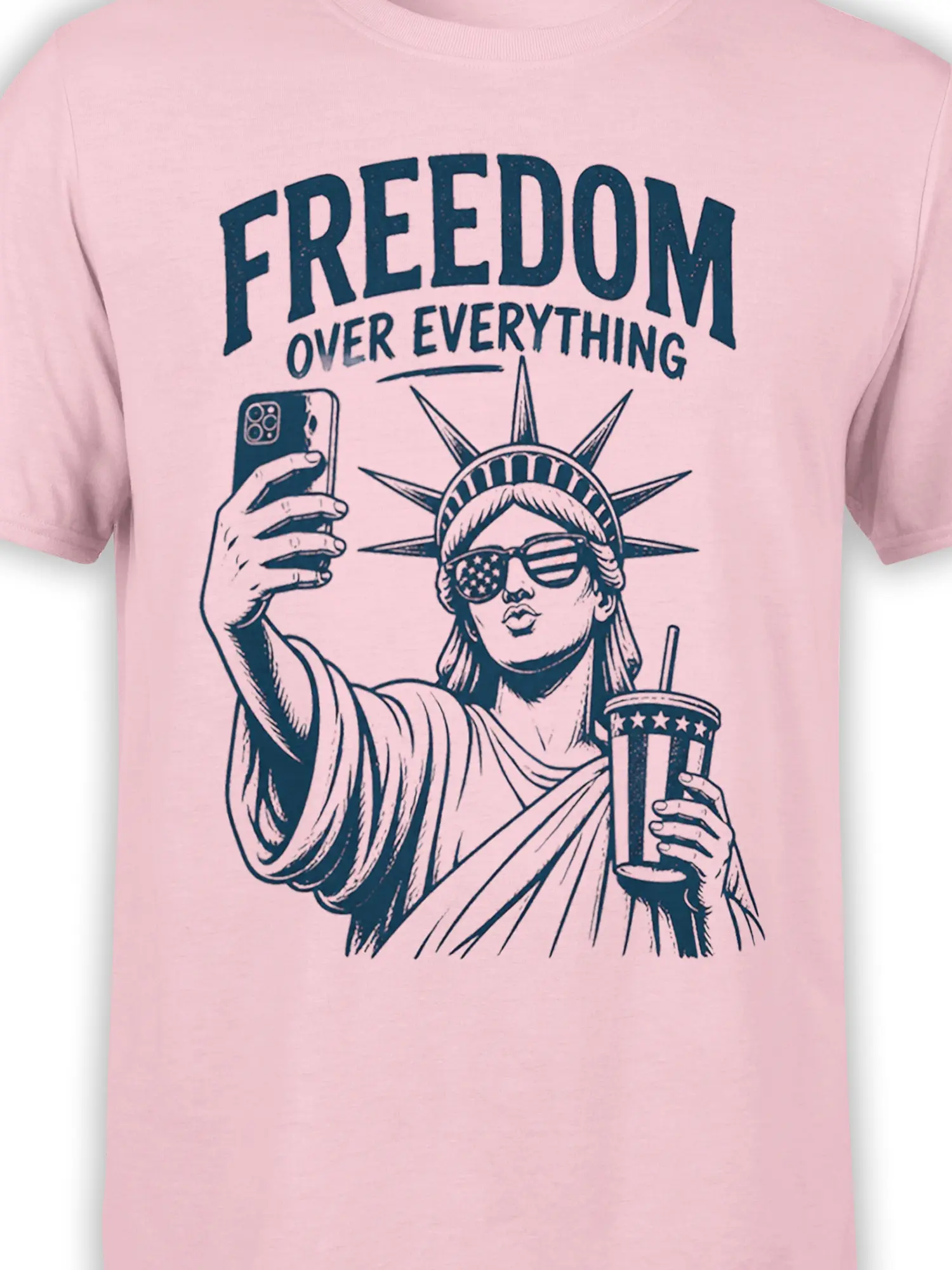 Close-up of Statue of Liberty selfie artwork with bold Freedom Over Everything text on pink fabric