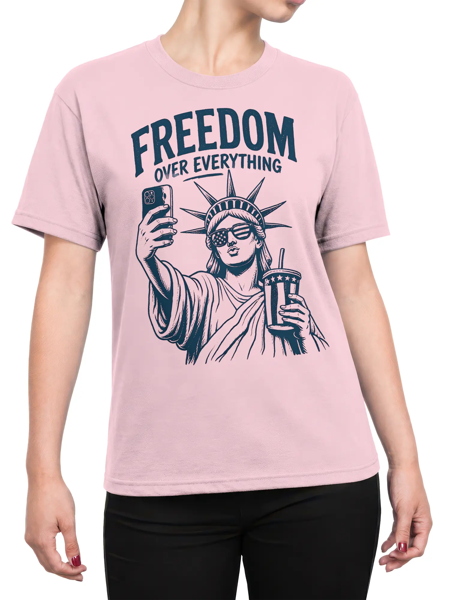 Female torso wearing a pink Statue of Liberty selfie T-shirt with bold navy lettering and vintage artwork