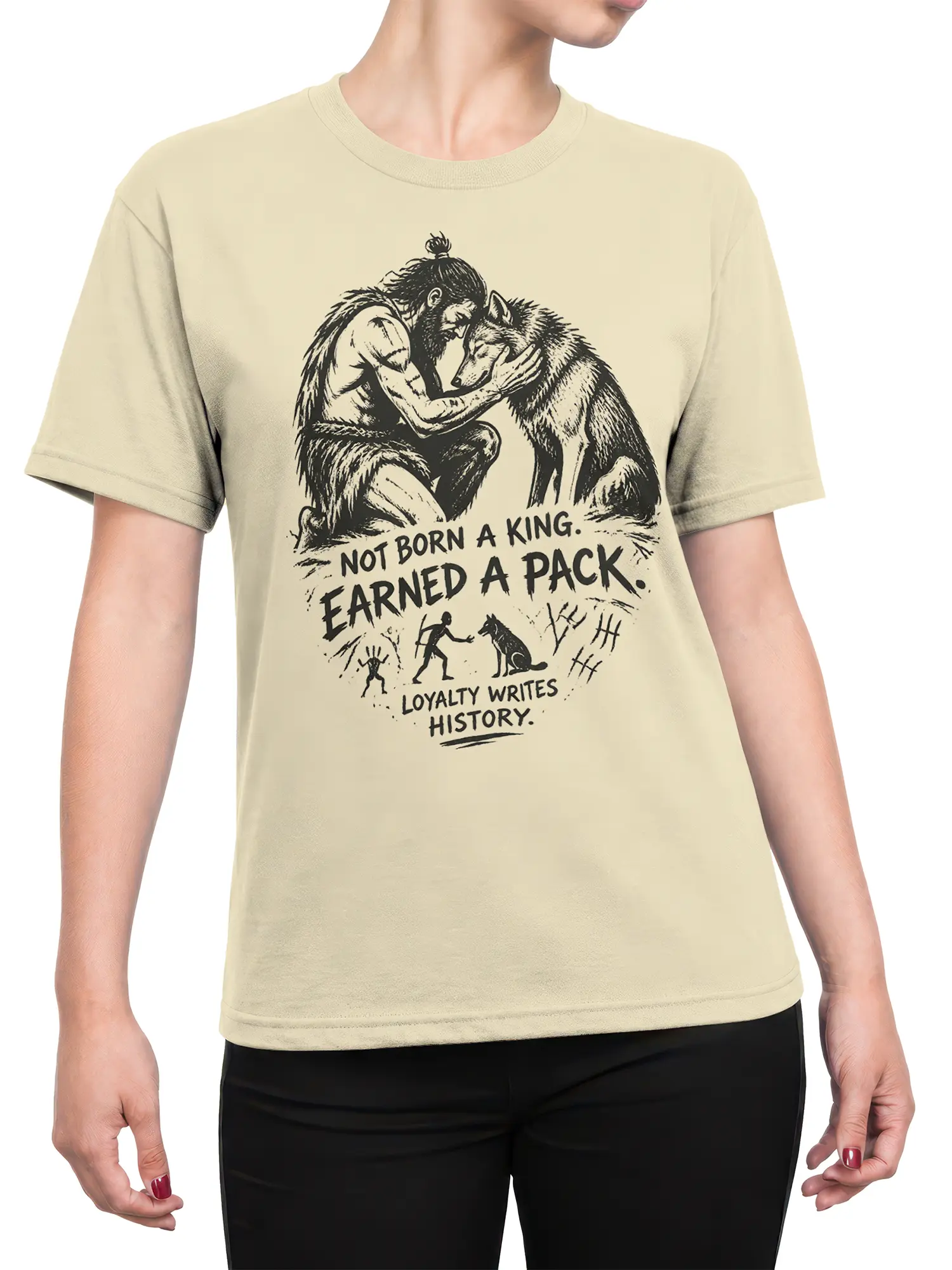Female torso wearing a beige wolf T-shirt with a bearded figure, wolf artwork, and loyalty message