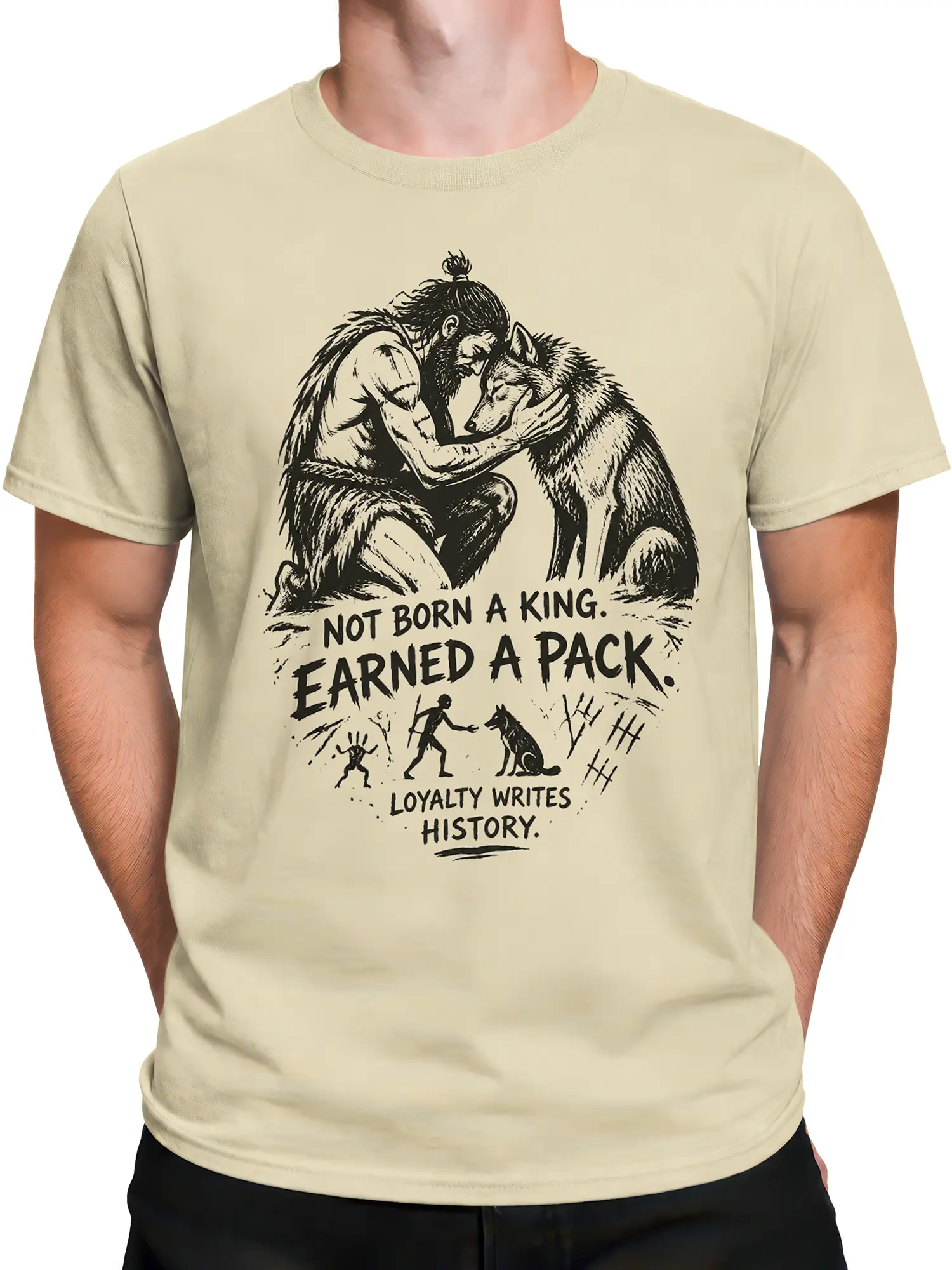 Male torso wearing a beige wolf T-shirt with rugged loyalty artwork and earned pack lettering