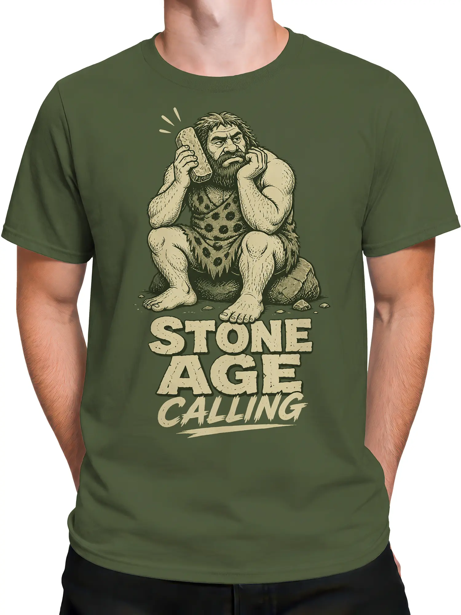 Male torso wearing a green Stone Age Caveman T-shirt with vintage prehistoric artwork
