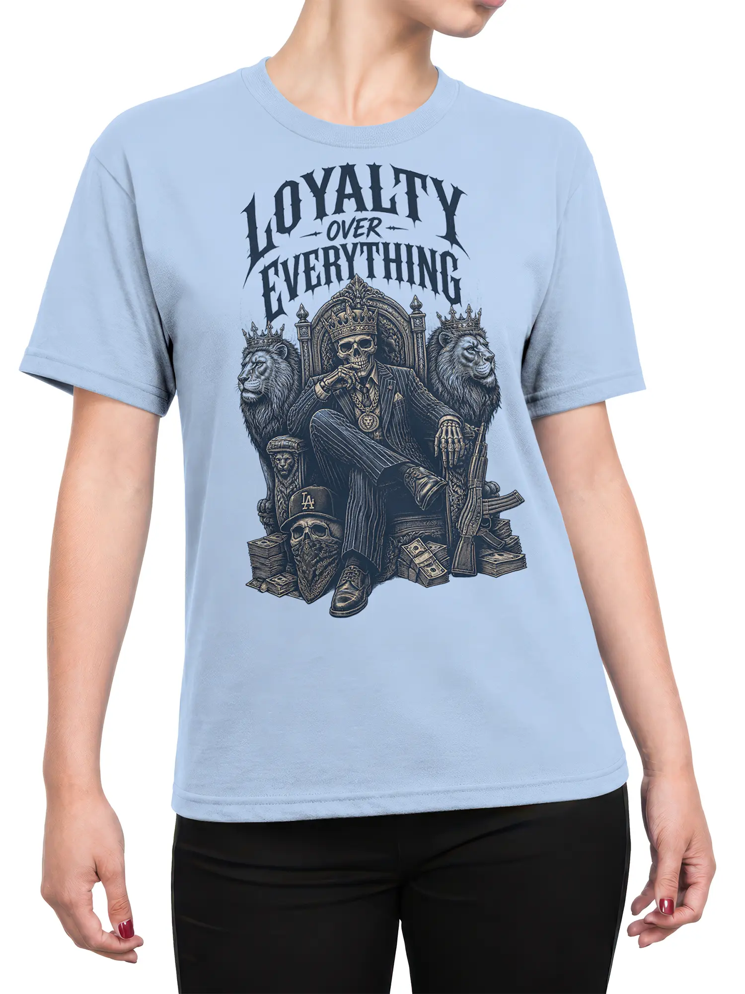 Female torso wearing a light blue skull king T-shirt with crowned lions, throne artwork, and loyalty slogan