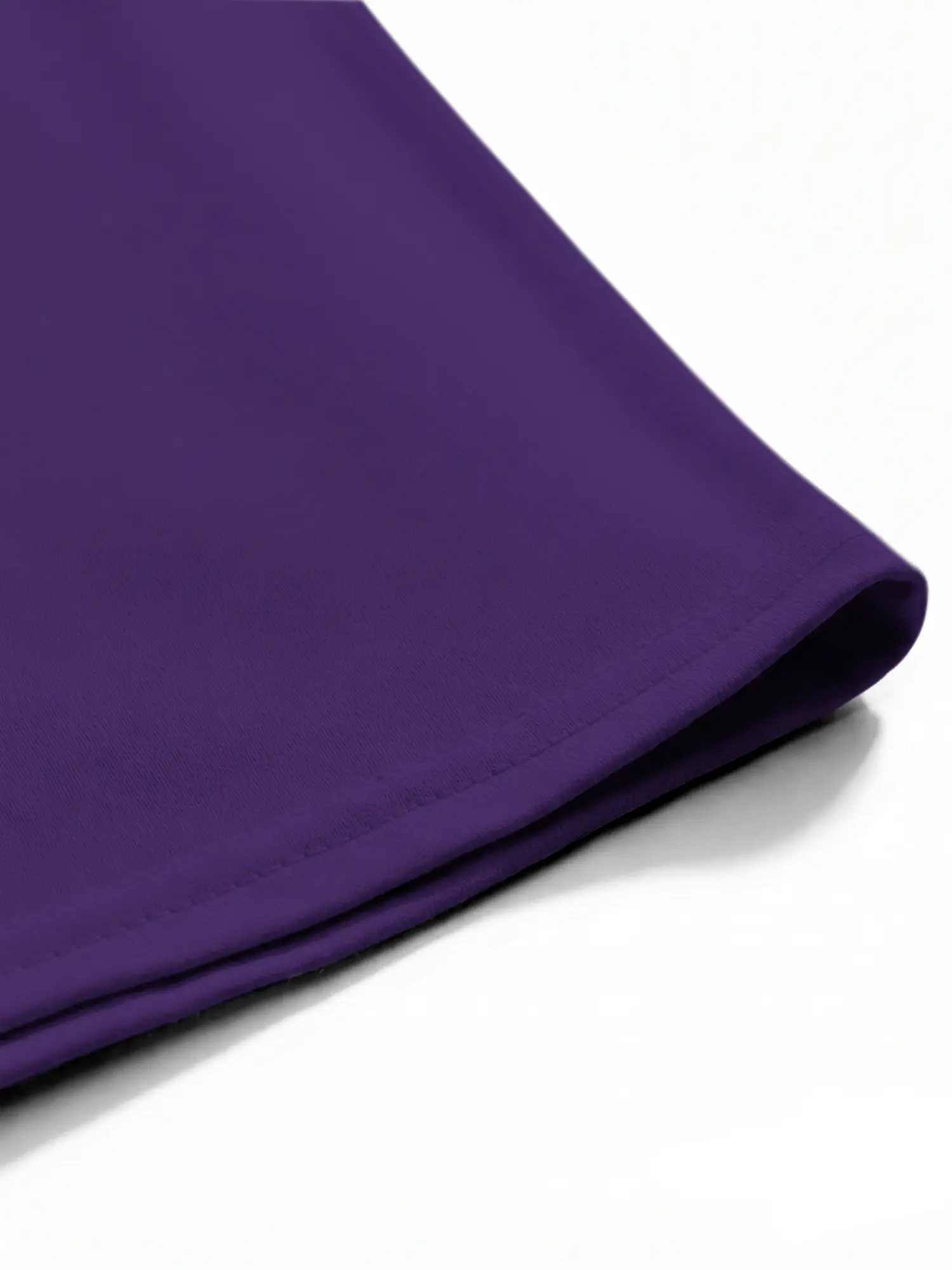 Purple cotton T-shirt hem and stitching shown in a detailed close-up