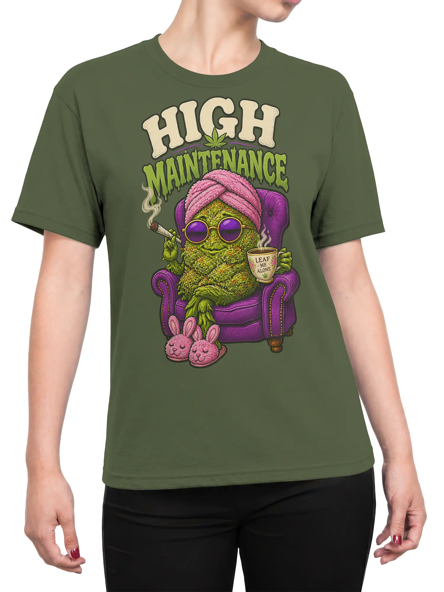 Female torso wearing an olive cannabis T-shirt with a colorful leafy character and “Leaf Me Alone” cup design