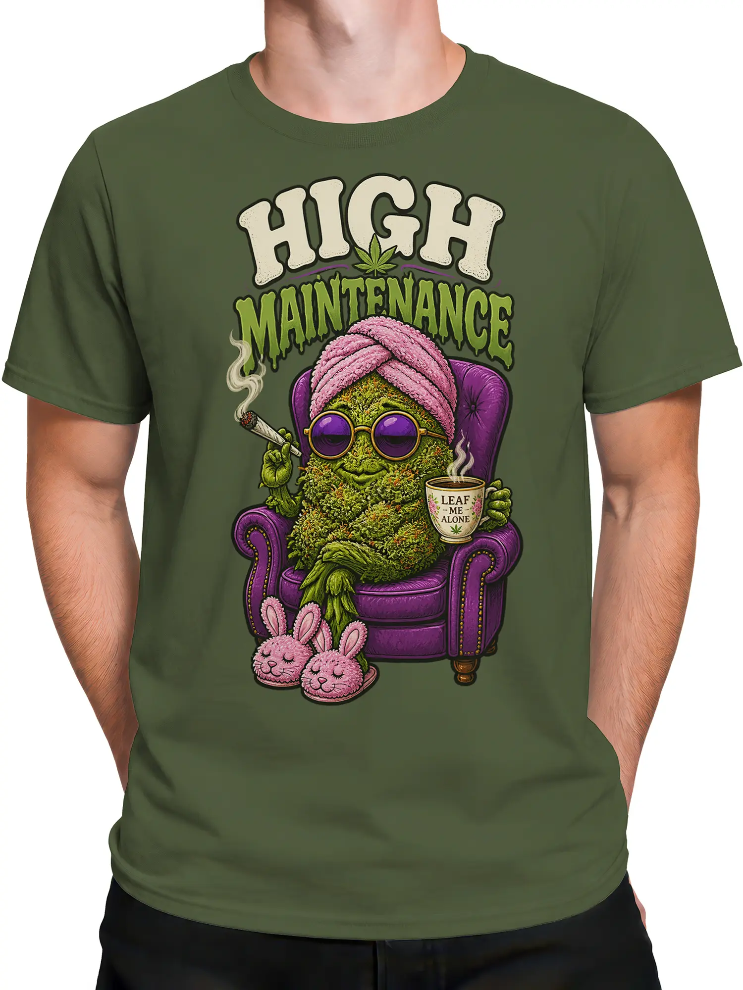 Male torso wearing olive cannabis graphic tee with lounging leafy character and “High Maintenance” text