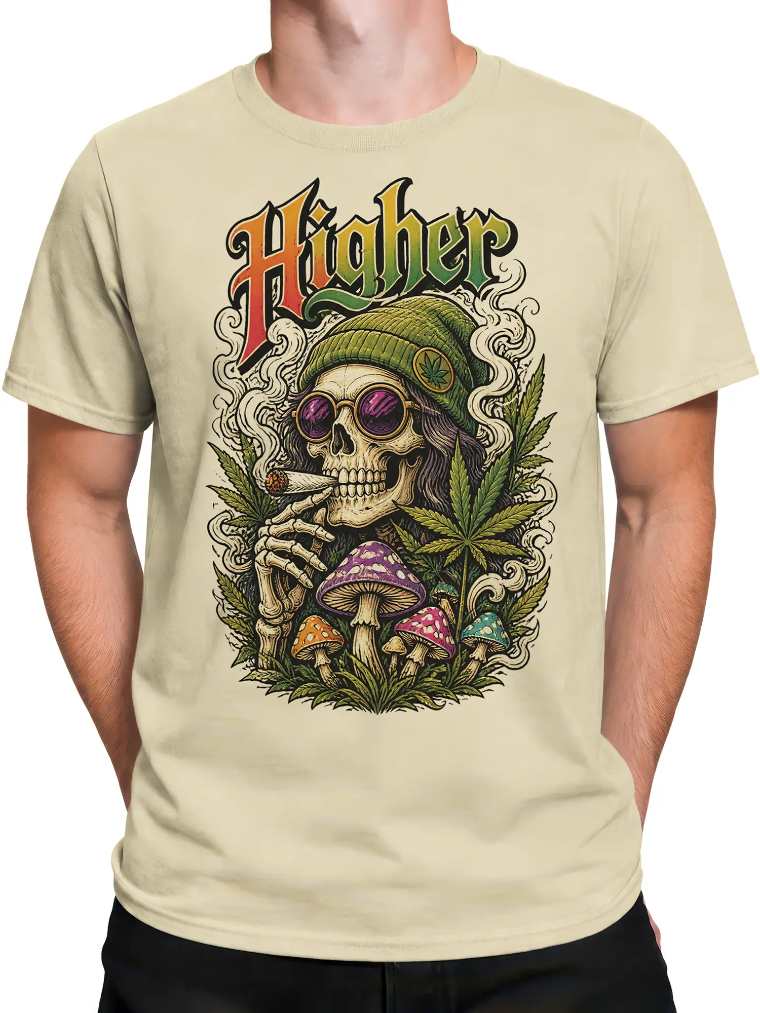 Male torso wearing a beige Higher skeleton T-shirt with colorful mushrooms, leafy plants, smoke, and psychedelic skull artwork