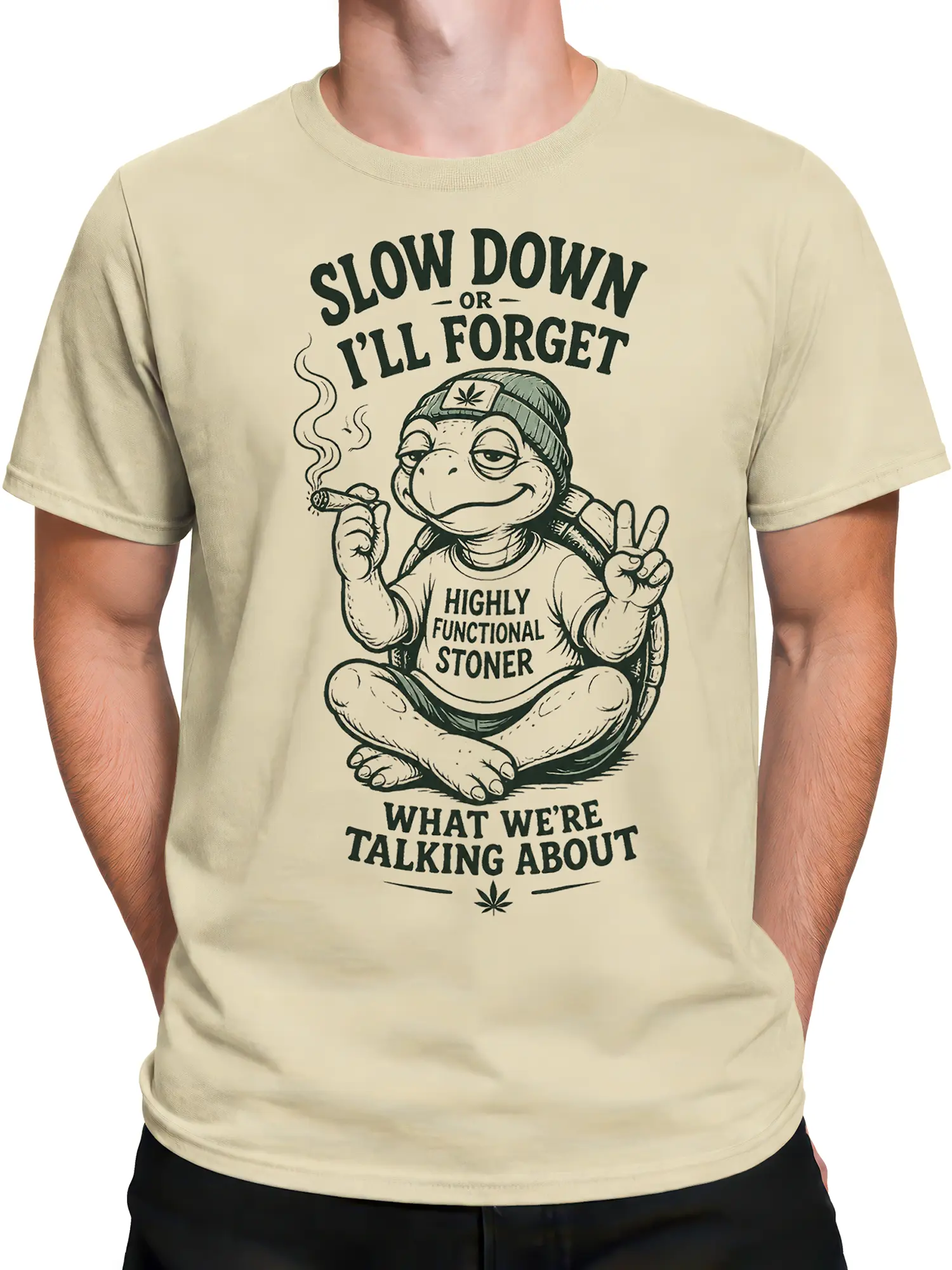 Male torso wearing a cream turtle stoner T-shirt with a mellow graphic and bold vintage lettering