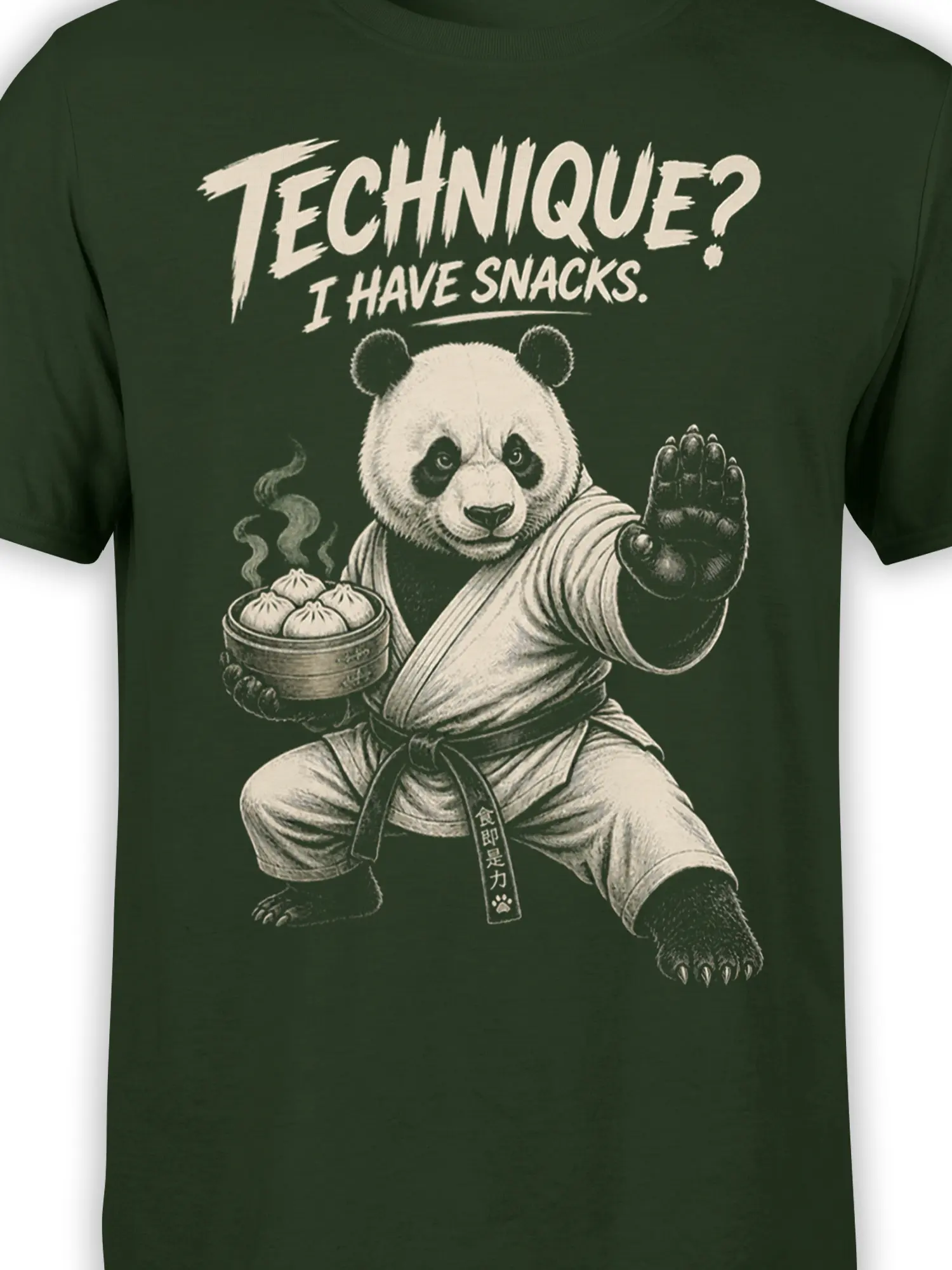 Close-up of panda martial arts artwork, steaming dumplings, and snack slogan on a dark green T-shirt