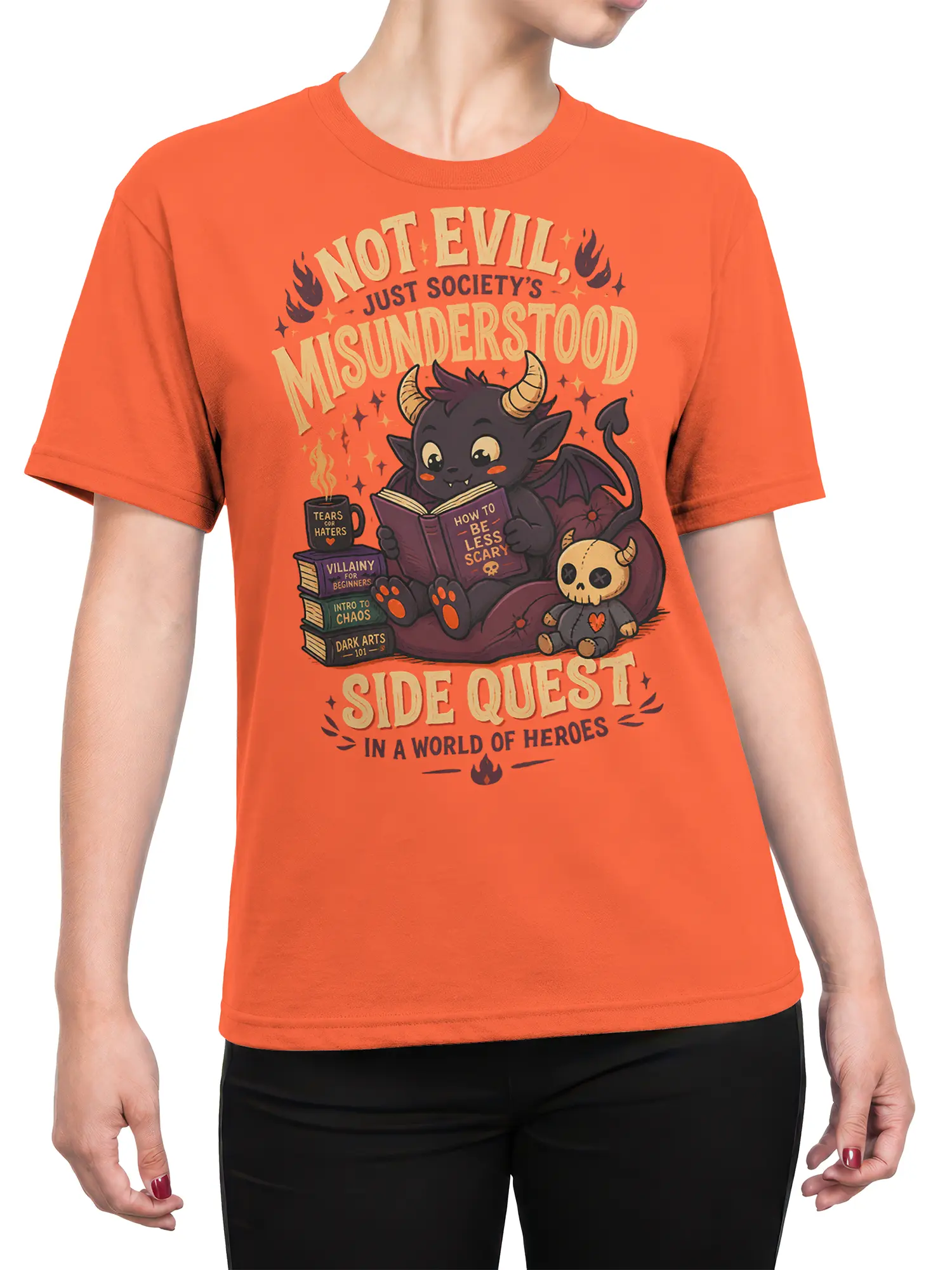 Female torso wearing an orange coral T-shirt with a cute misunderstood demon fantasy design