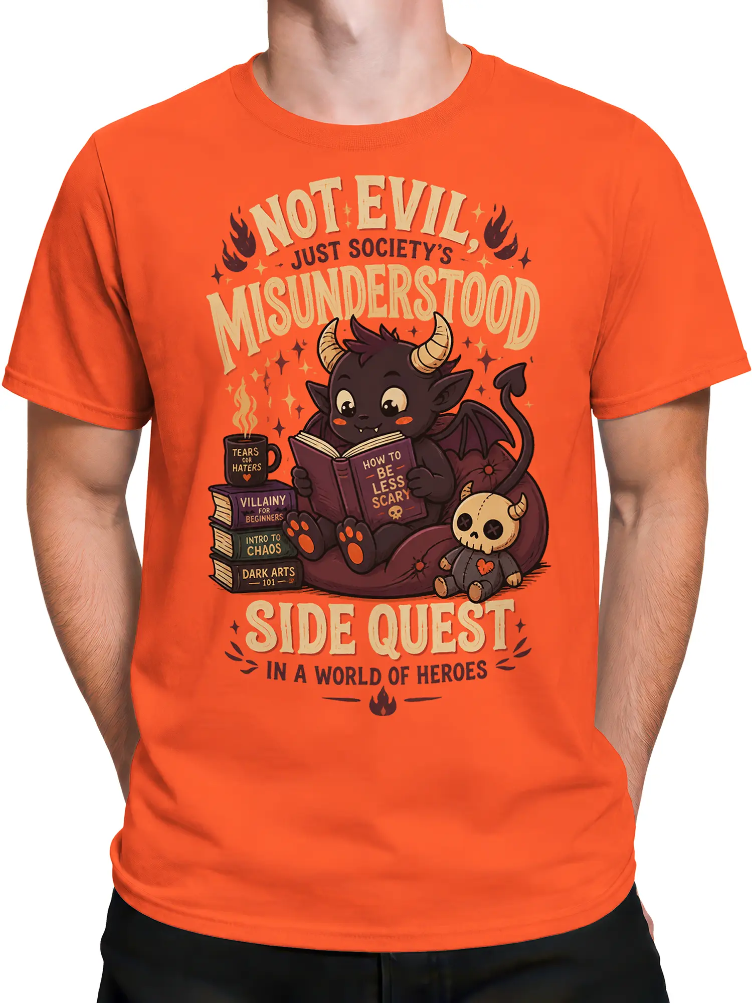 Male torso wearing an orange coral T-shirt with a horned demon and dark humor design