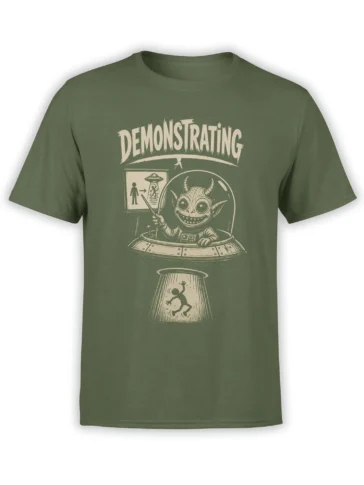 Green alien abduction T-shirt with horned extraterrestrial, flying saucer, human diagram, and “Demonstrating” text