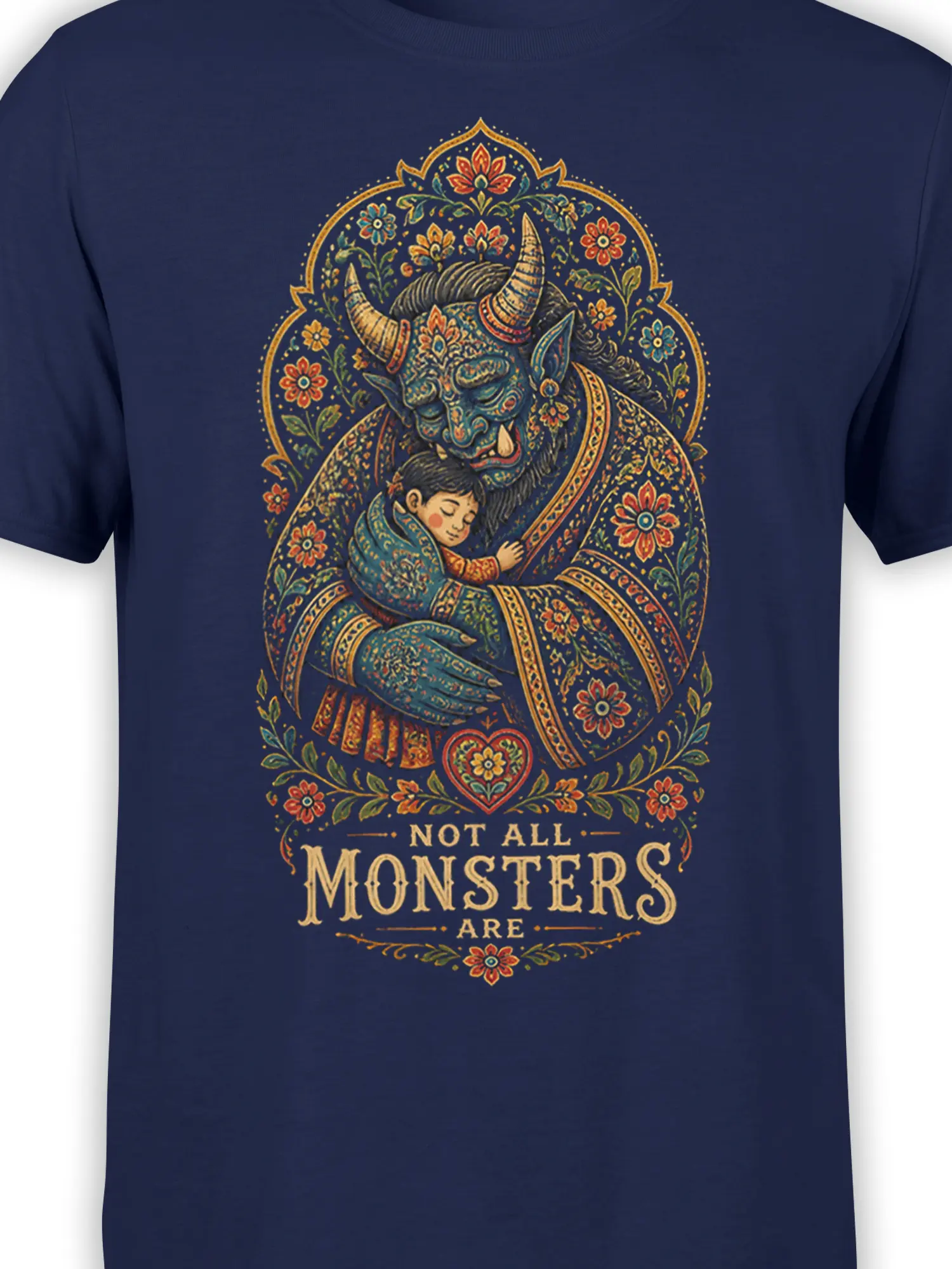 Close-up of the navy fantasy T-shirt design showing a horned monster, sleeping child, flowers, and decorative text