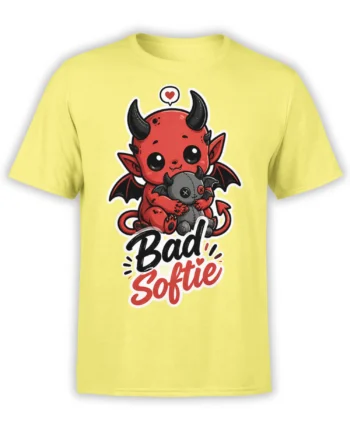 Yellow T-shirt with a cute red devil hugging a stitched bat plush and “Bad Softie” lettering
