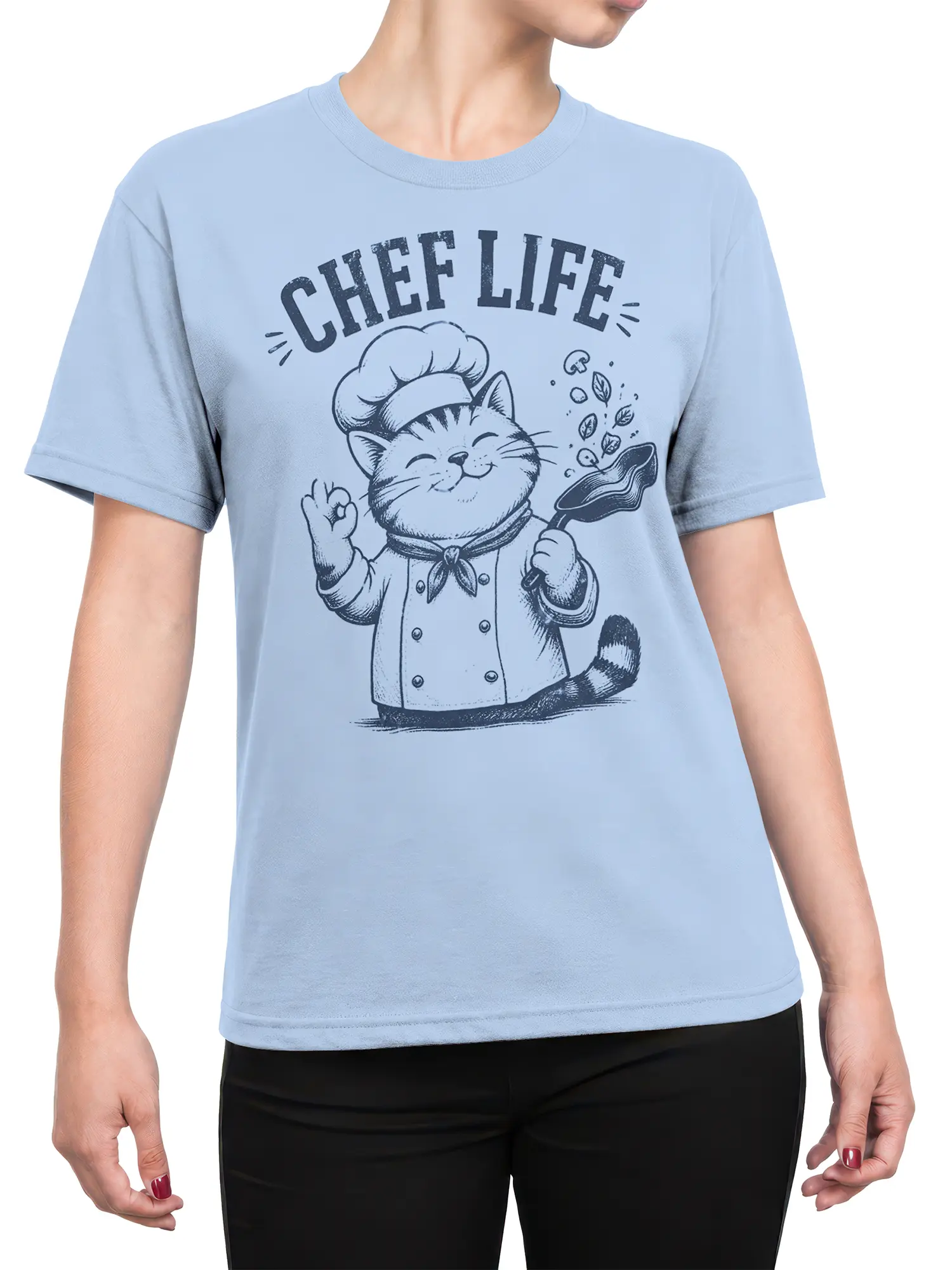 Female torso wearing a light blue cat chef T-shirt with CHEF LIFE lettering and frying pan artwork