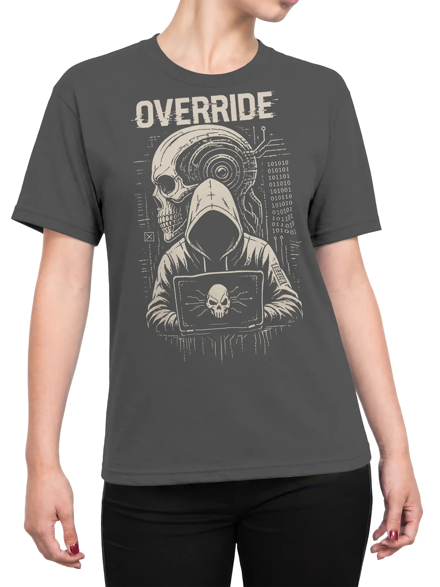 Female torso wearing a dark gray cyber skull T-shirt with hooded figure, laptop skull, binary code, and OVERRIDE design