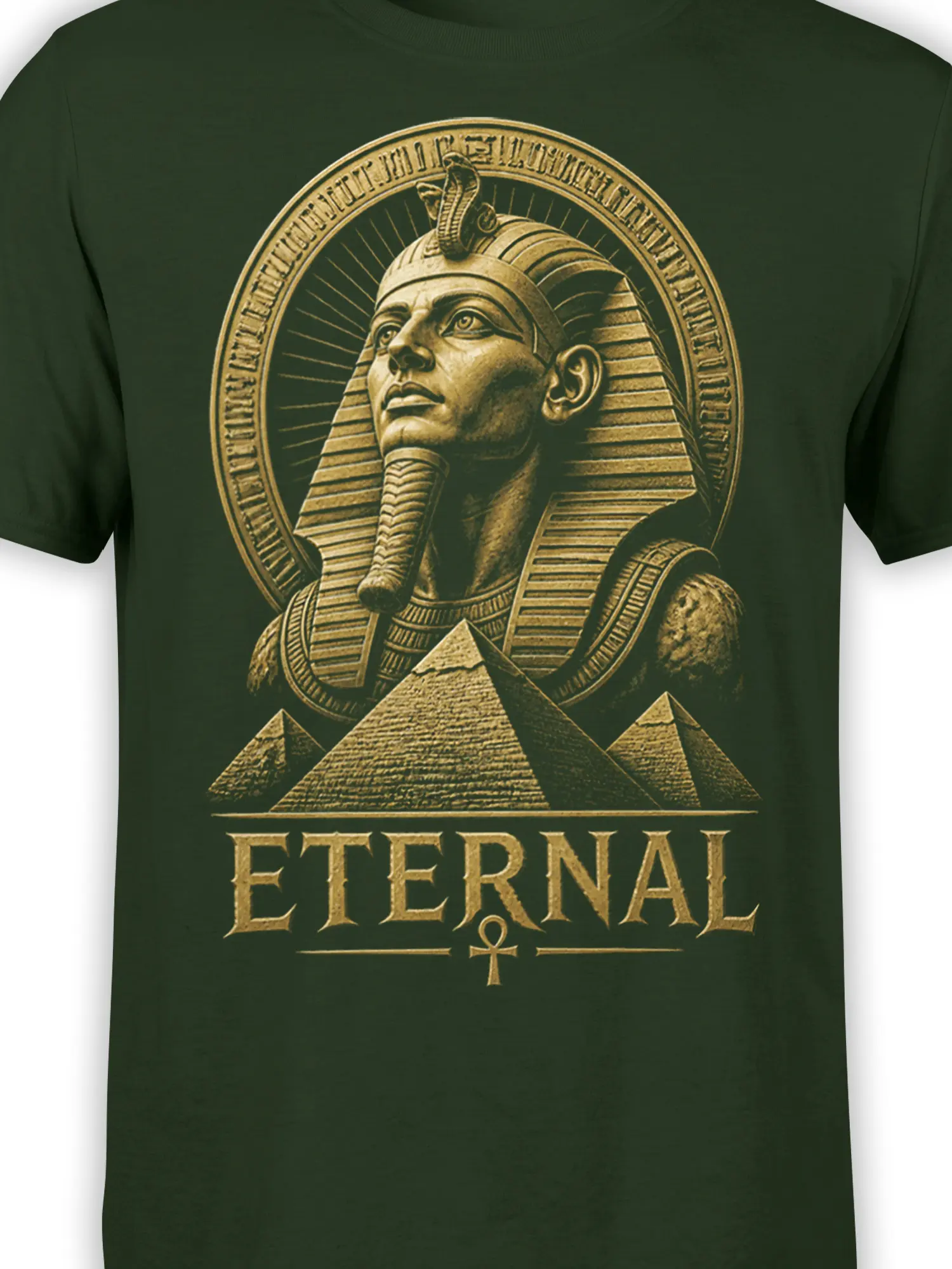 Close-up of pharaoh headdress, pyramids, ankh, and antique-gold “ETERNAL” design on green