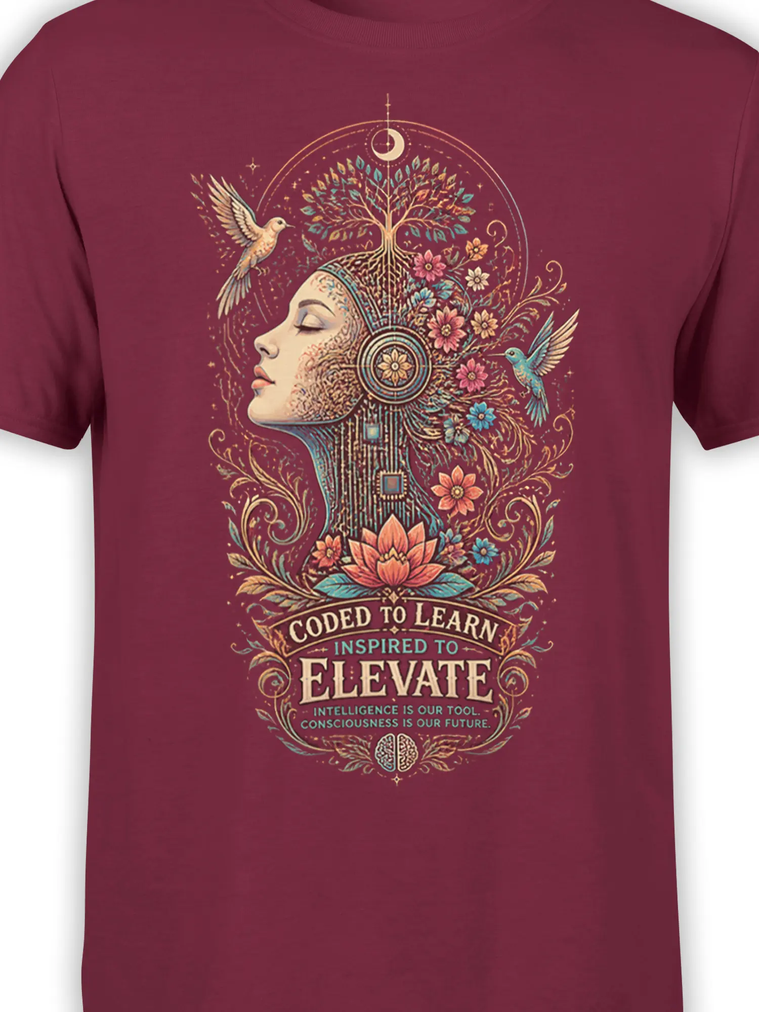 Close-up of the maroon shirt design showing a female profile, branching tree, flowers, hummingbirds, and lotus