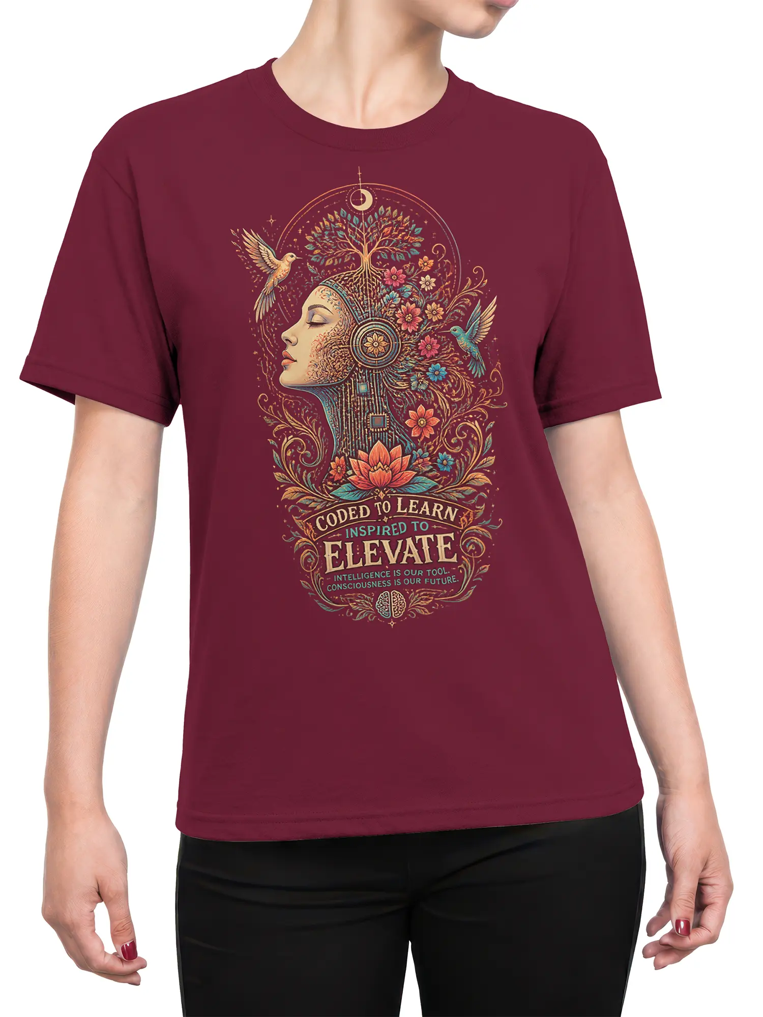 Female torso wearing a maroon inspirational T-shirt with a floral mind design, hummingbirds, lotus, moon, and wisdom message