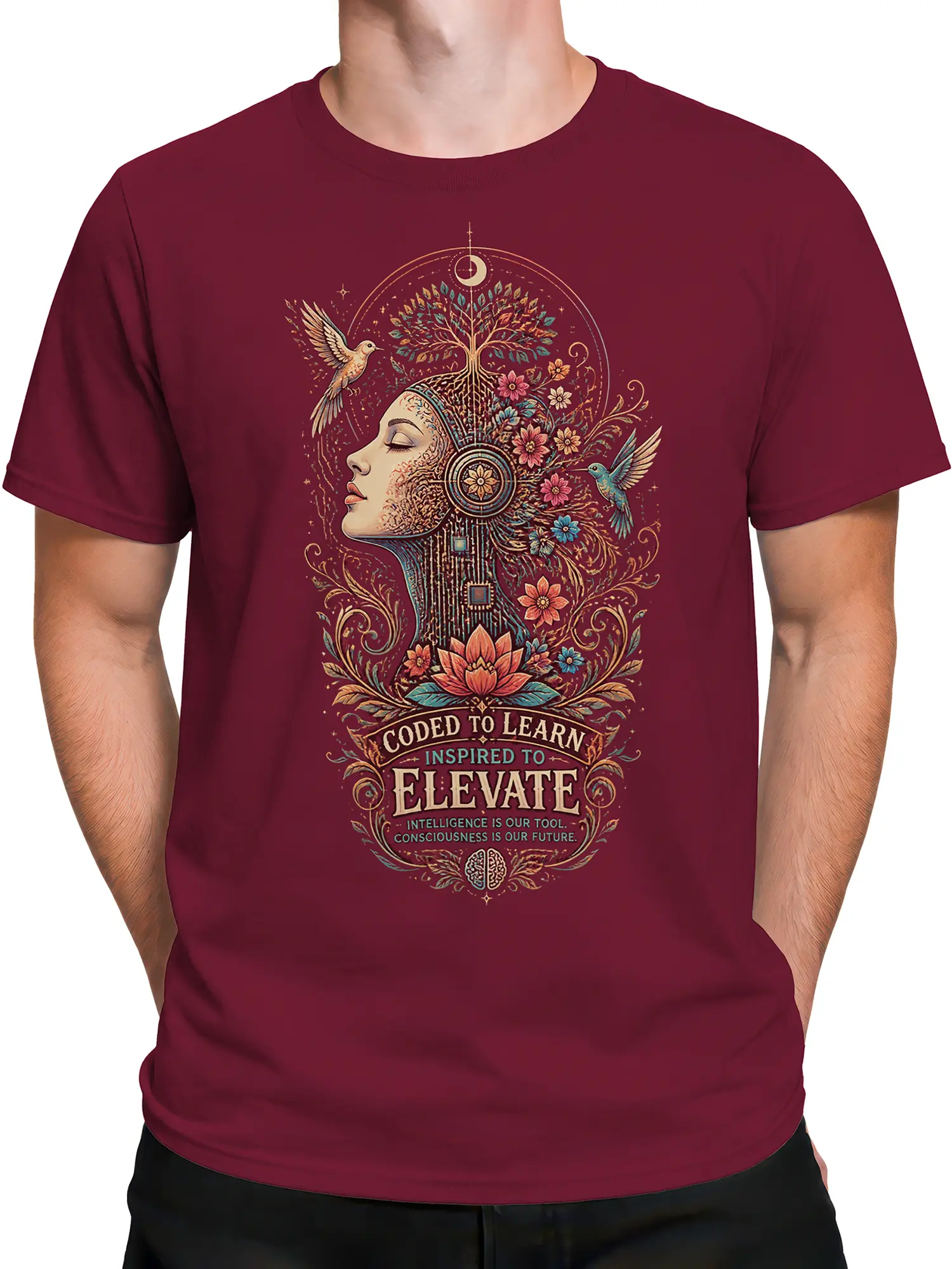 Male torso wearing a maroon T-shirt with an artistic female profile, tree, flowers, hummingbirds, lotus, and inspirational text
