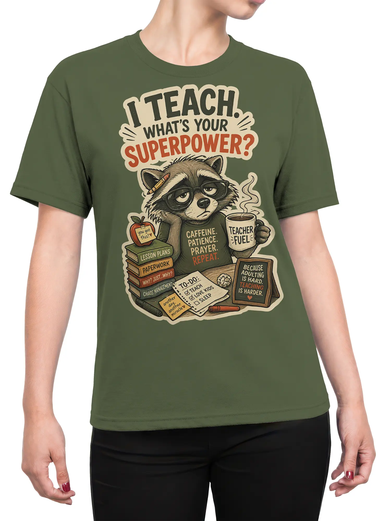 Female torso wearing a green raccoon teacher T-shirt with coffee, books, paperwork, and classroom artwork
