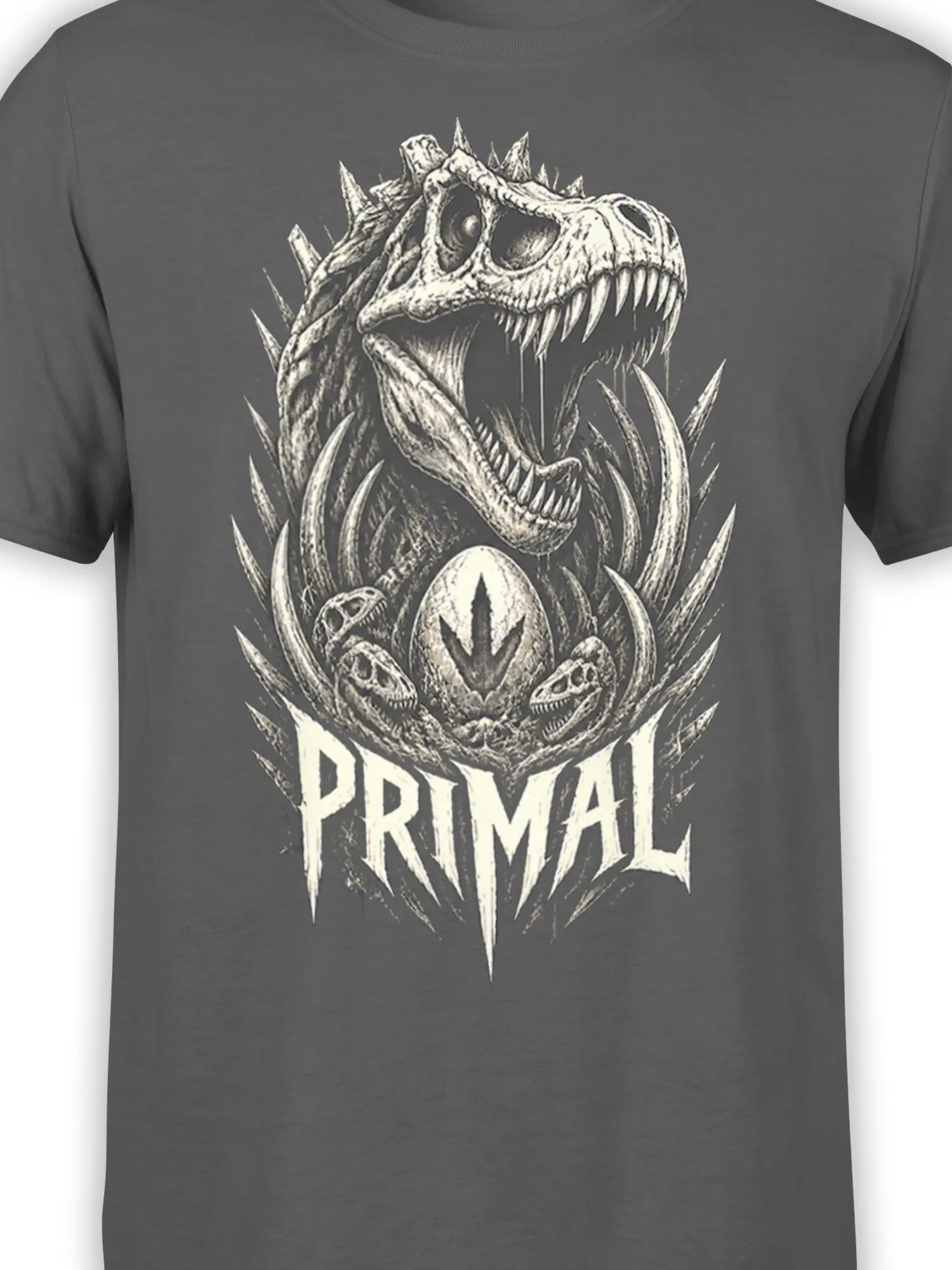 Close-up of cream dinosaur skull artwork and PRIMAL lettering on a gray prehistoric T-shirt