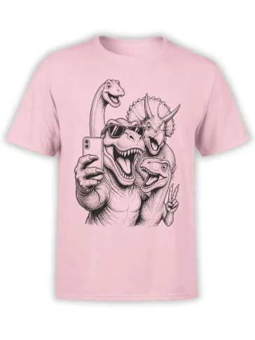 Pink dinosaur T-shirt with a vintage group selfie illustration featuring sunglasses, sharp teeth, and playful prehistoric creatures