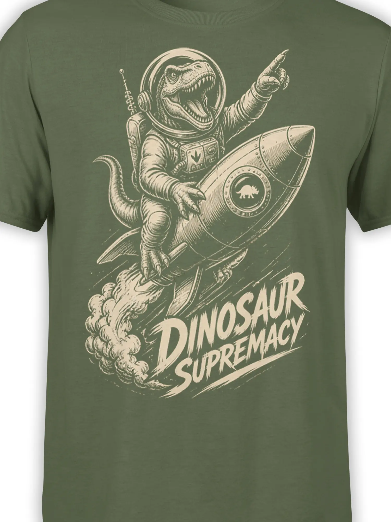 Close-up of roaring dinosaur astronaut artwork and rocket details on an olive green graphic tee