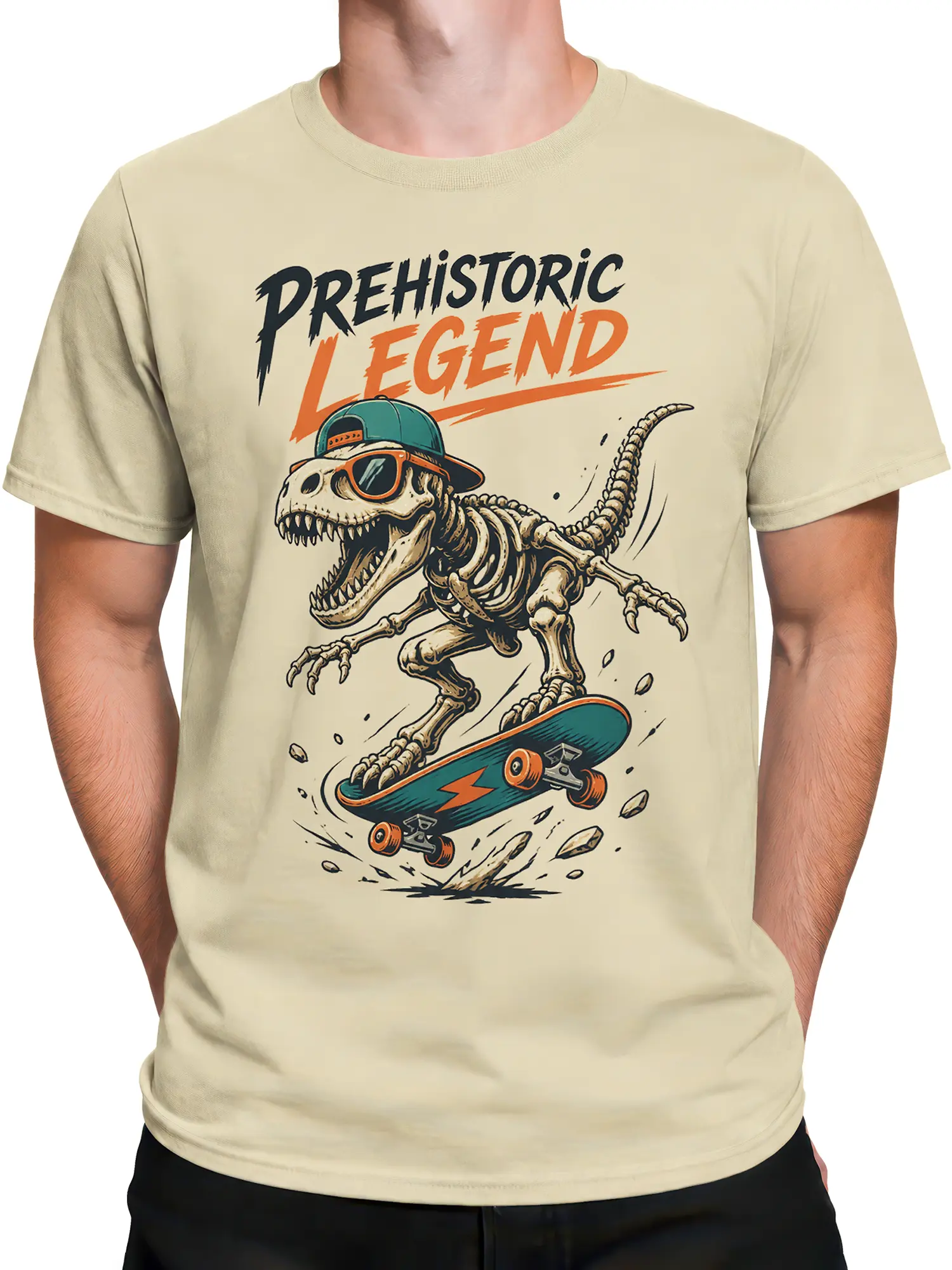 Male torso wearing a beige dinosaur graphic tee with a skeleton skateboarder and retro lettering
