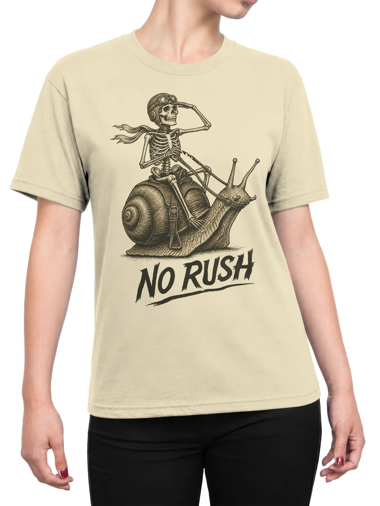Female torso wearing a beige skeleton snail T-shirt with goggles, scarf, and "NO RUSH" artwork