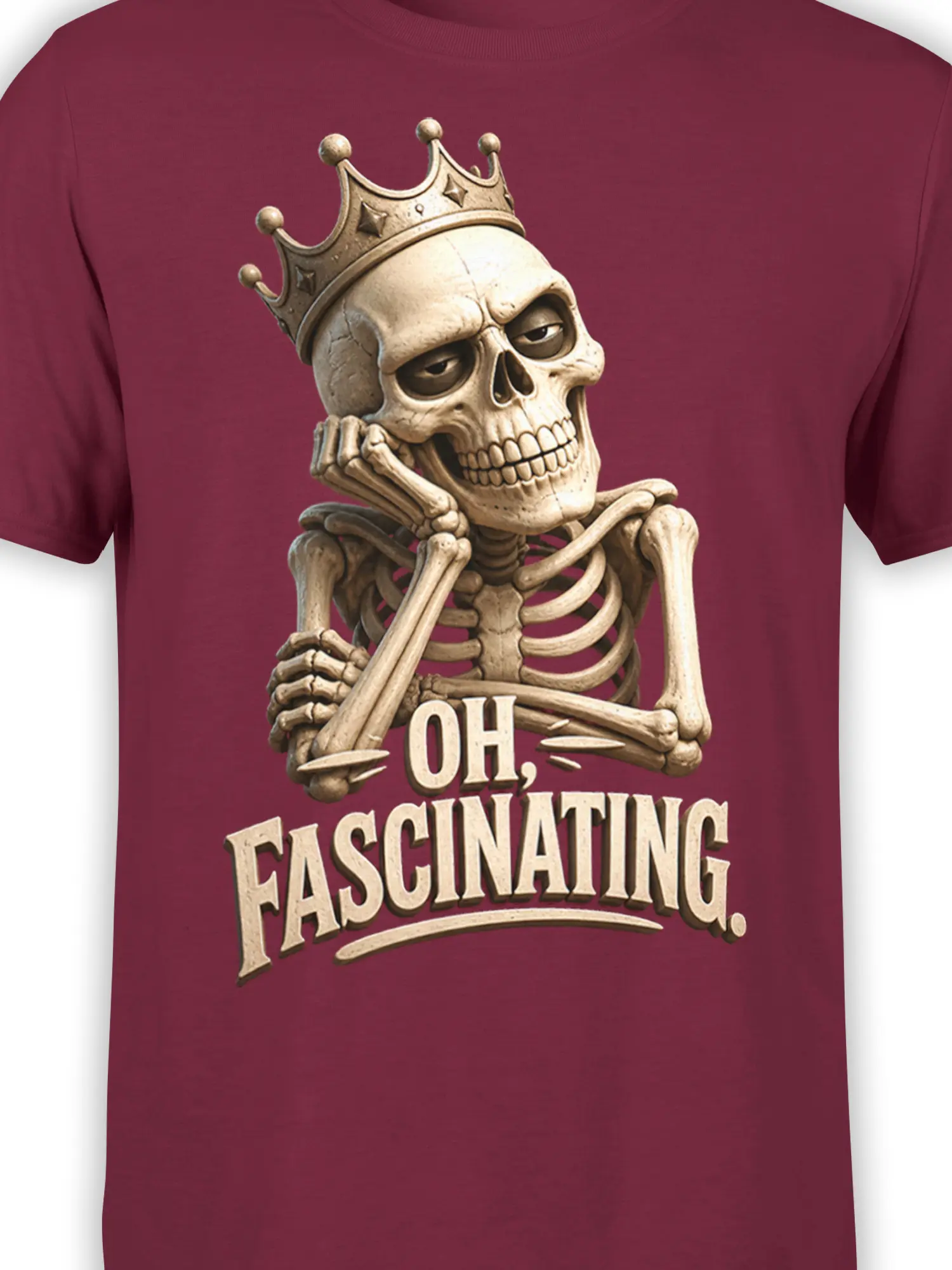 Close-up of crowned skeleton artwork and vintage “OH, FASCINATING” text on burgundy fabric