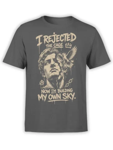 Gray freedom T-shirt with distressed human face, flying bird, broken chain, and “Building My Own Sky” lettering