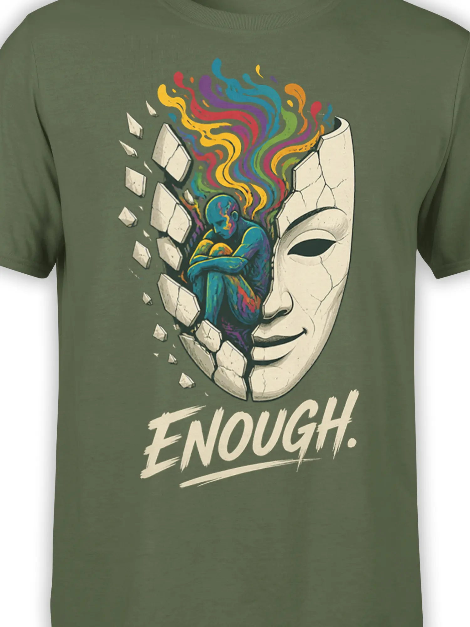 Close-up of cracked face and colorful inner figure artwork on an olive green T-shirt