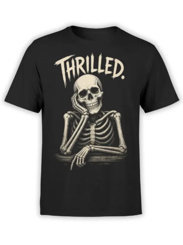 Black T-shirt with a relaxed grinning skeleton and distressed cream “THRILLED.” lettering