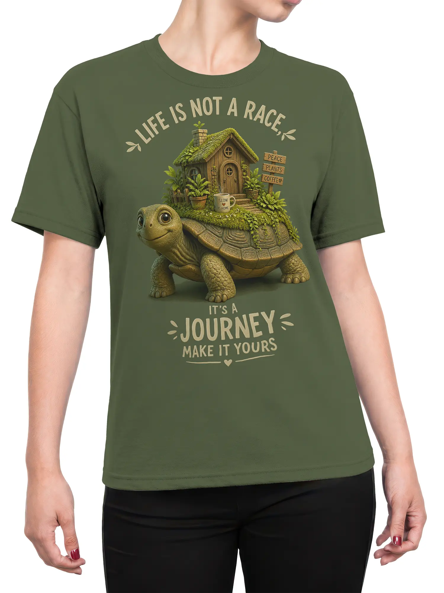 Female torso wearing a green turtle T-shirt with a tiny cottage, plants, coffee, and Life Is Not a Race design