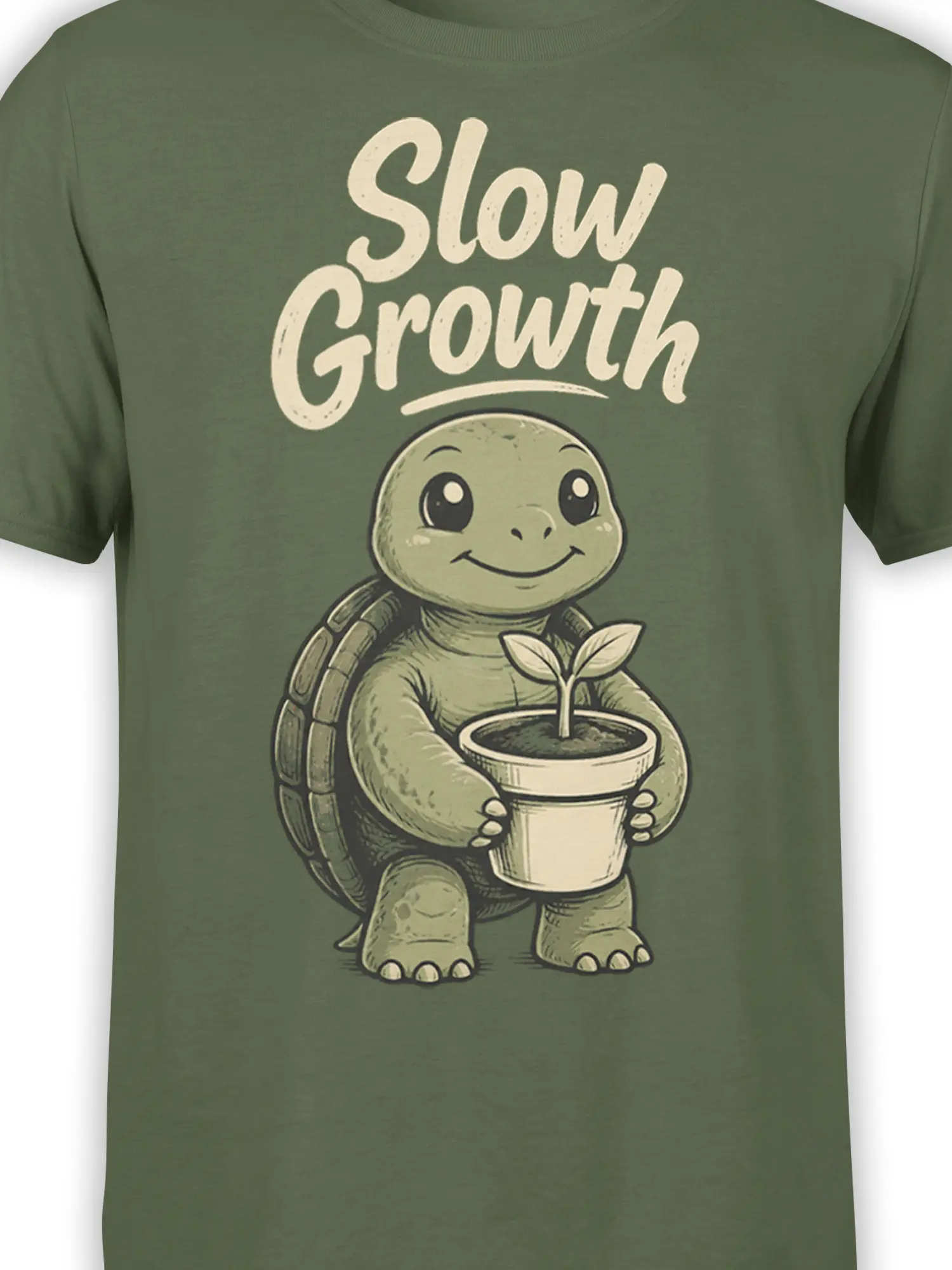 Close-up of the smiling turtle, potted sprout, and “Slow Growth” artwork on a green shirt