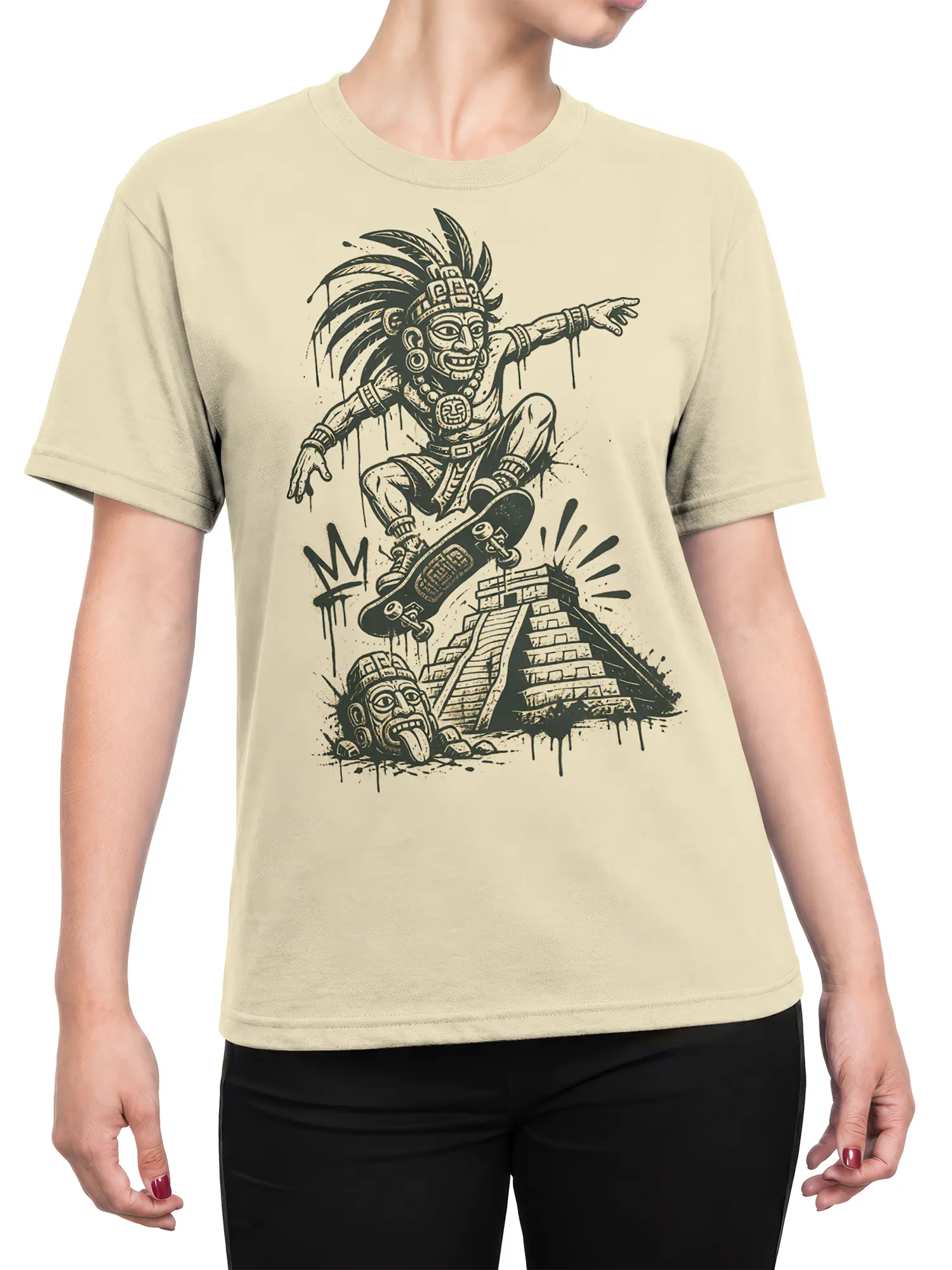 Female torso wearing a beige skateboard T-shirt with feathered Mesoamerican-inspired figure and pyramid artwork