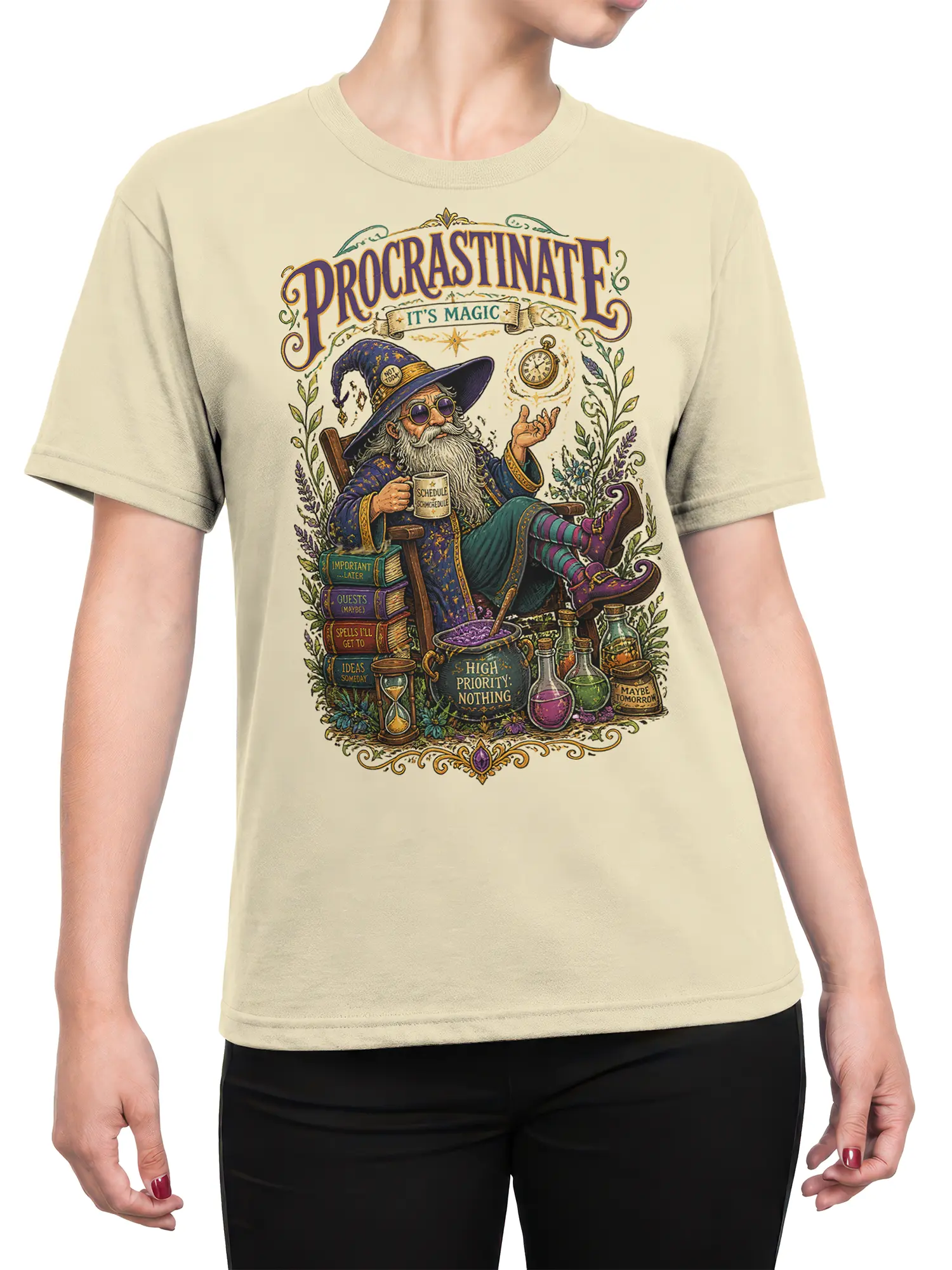 Female torso wearing a beige wizard T-shirt with vintage fantasy artwork, potions, books, and procrastination humor