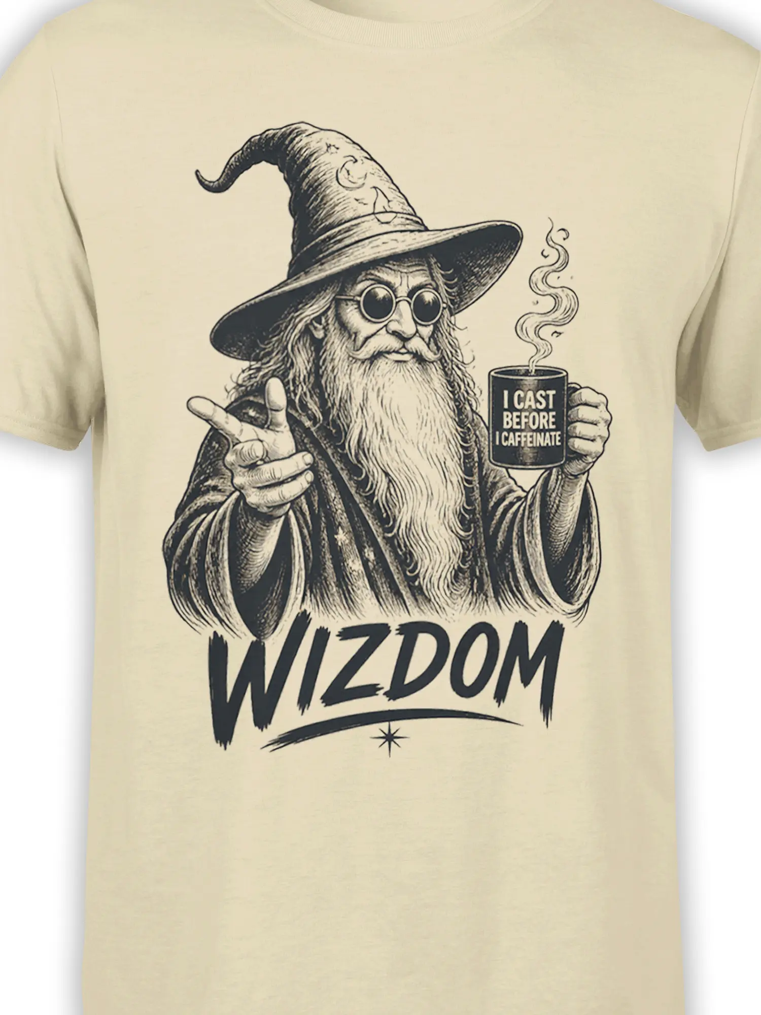 Close-up of vintage wizard coffee artwork and “WIZDOM” lettering on a beige T-shirt