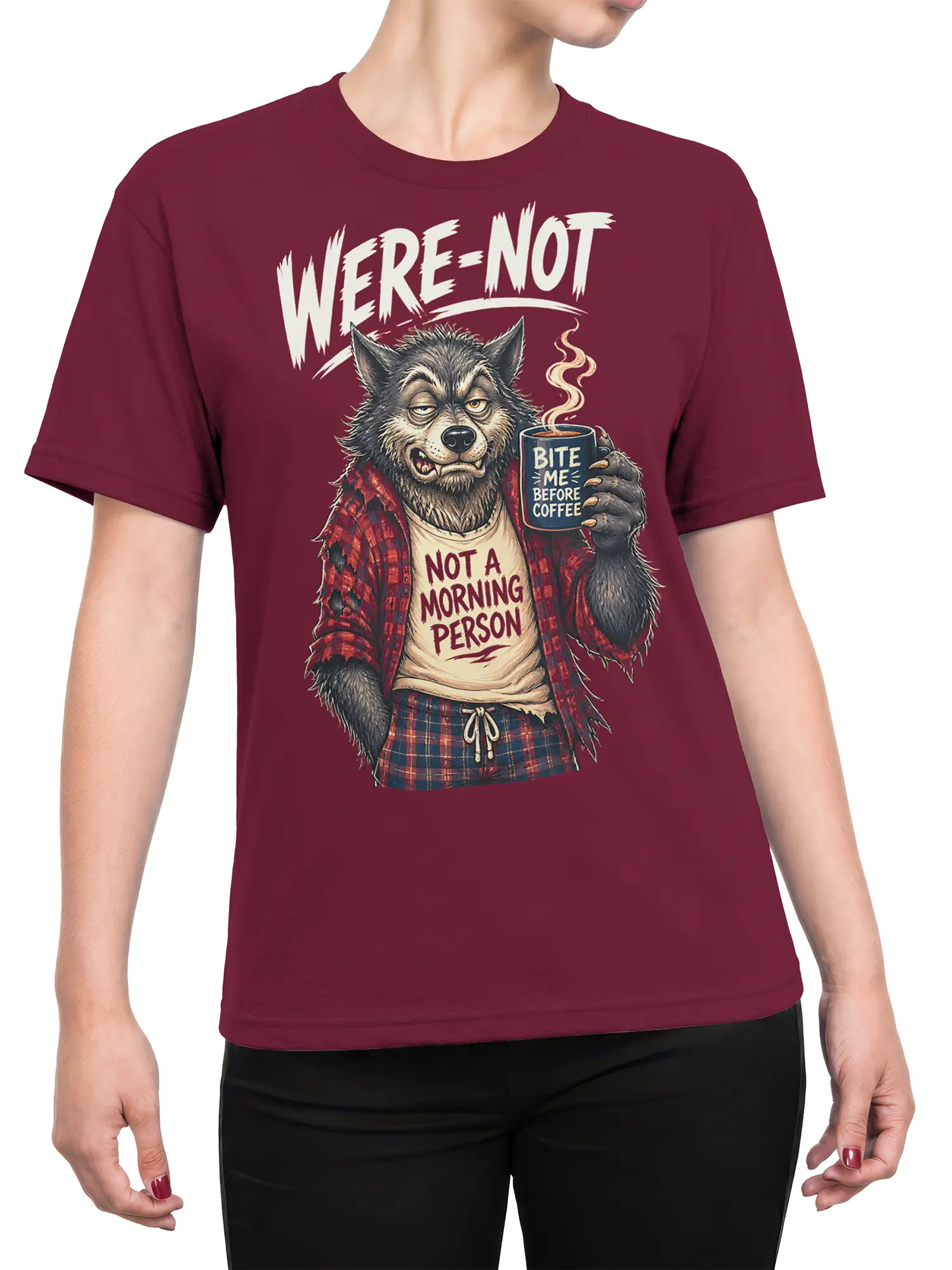 Female torso wearing burgundy wolf coffee T-shirt with grumpy morning message