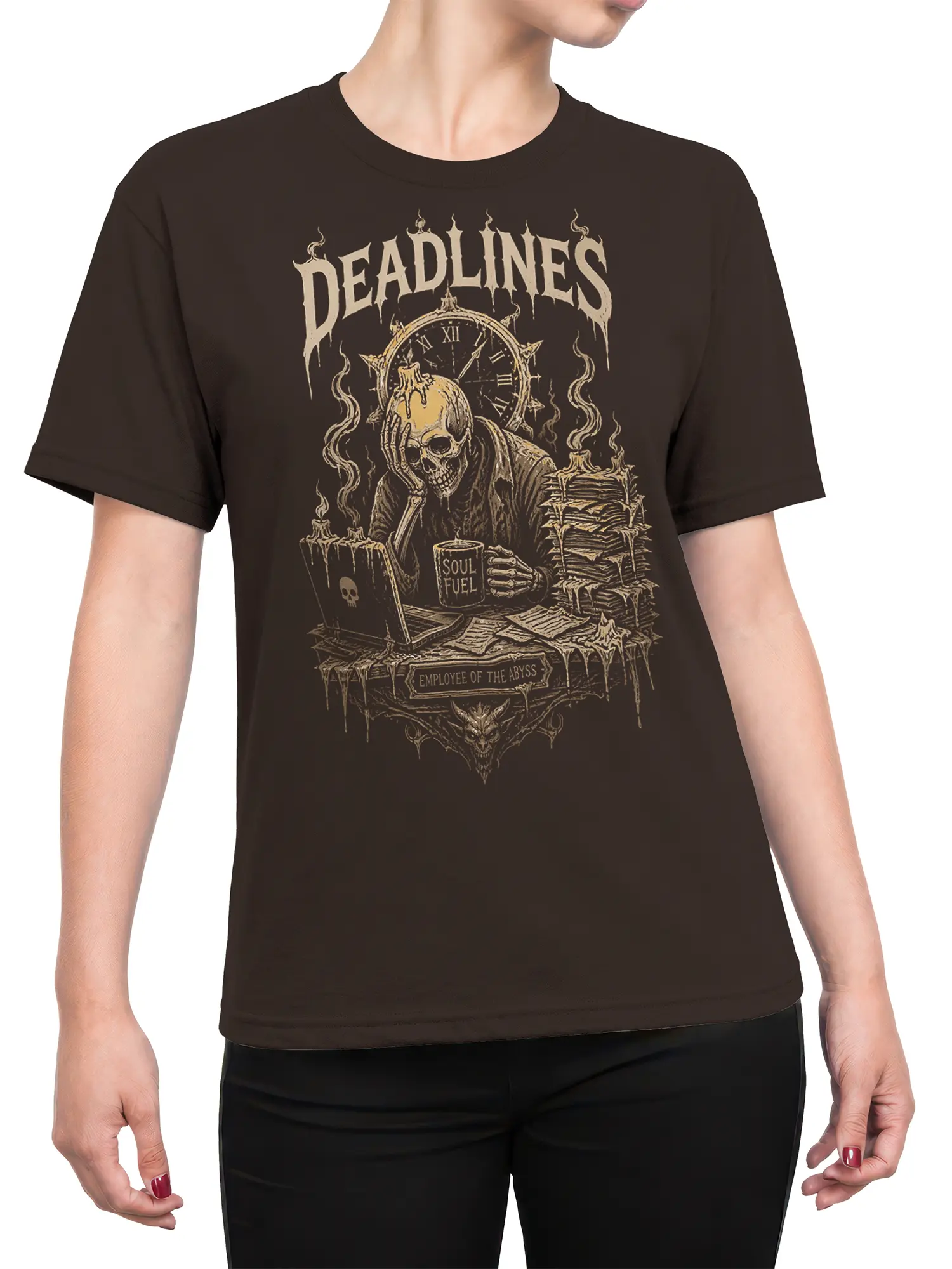 Female torso wearing a brown T-shirt with hooded skeleton artwork, candles, clock, and “DEADLINES” lettering